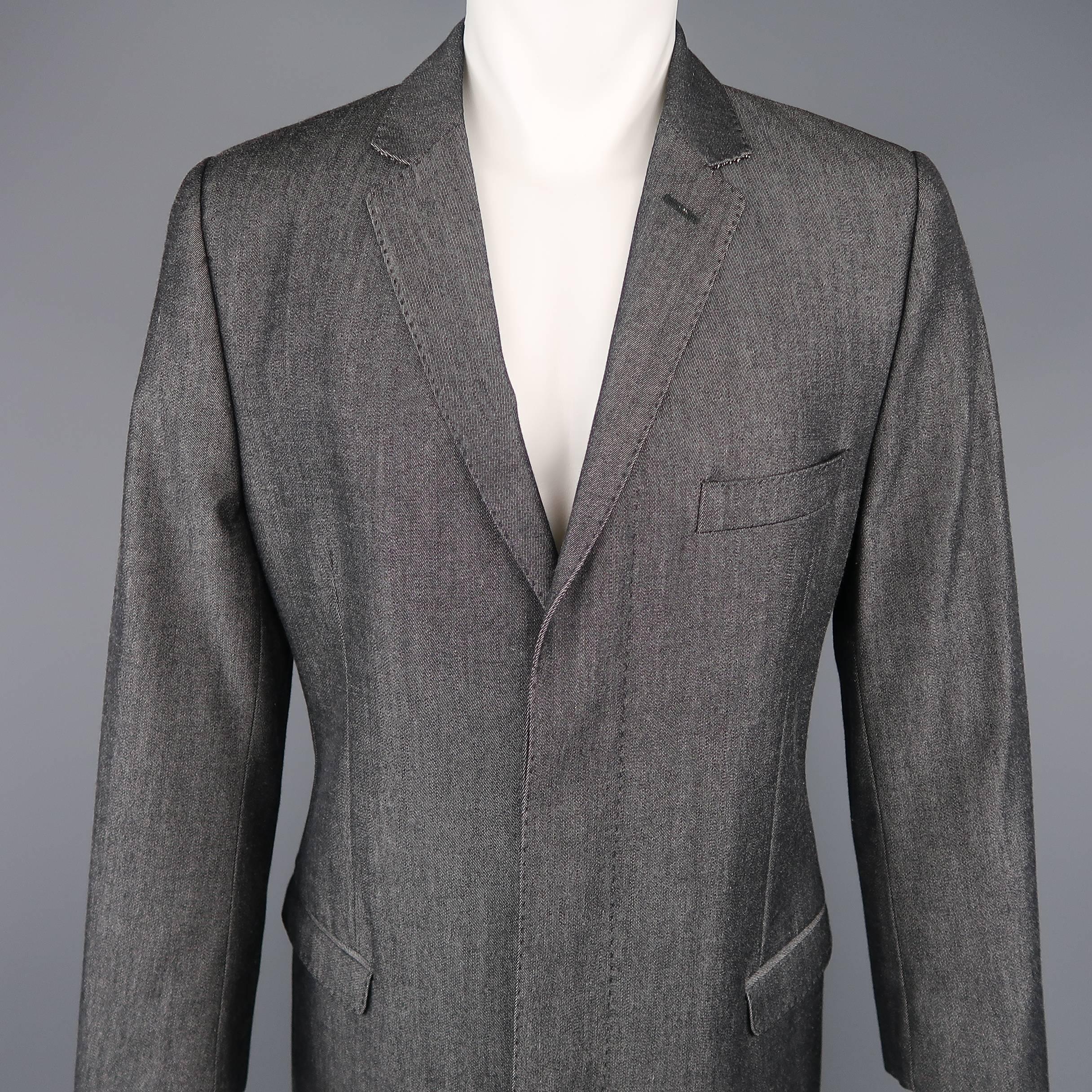 DOLCE & GABBANA coat comes in wool cotton blend denim material with a notch lapel, hidden placket button front, braided button cuffs, and top stitching throughout. Made in Italy.
 
Excellent Pre-Owned Condition.
Marked: IT 50
 
Measurements:
