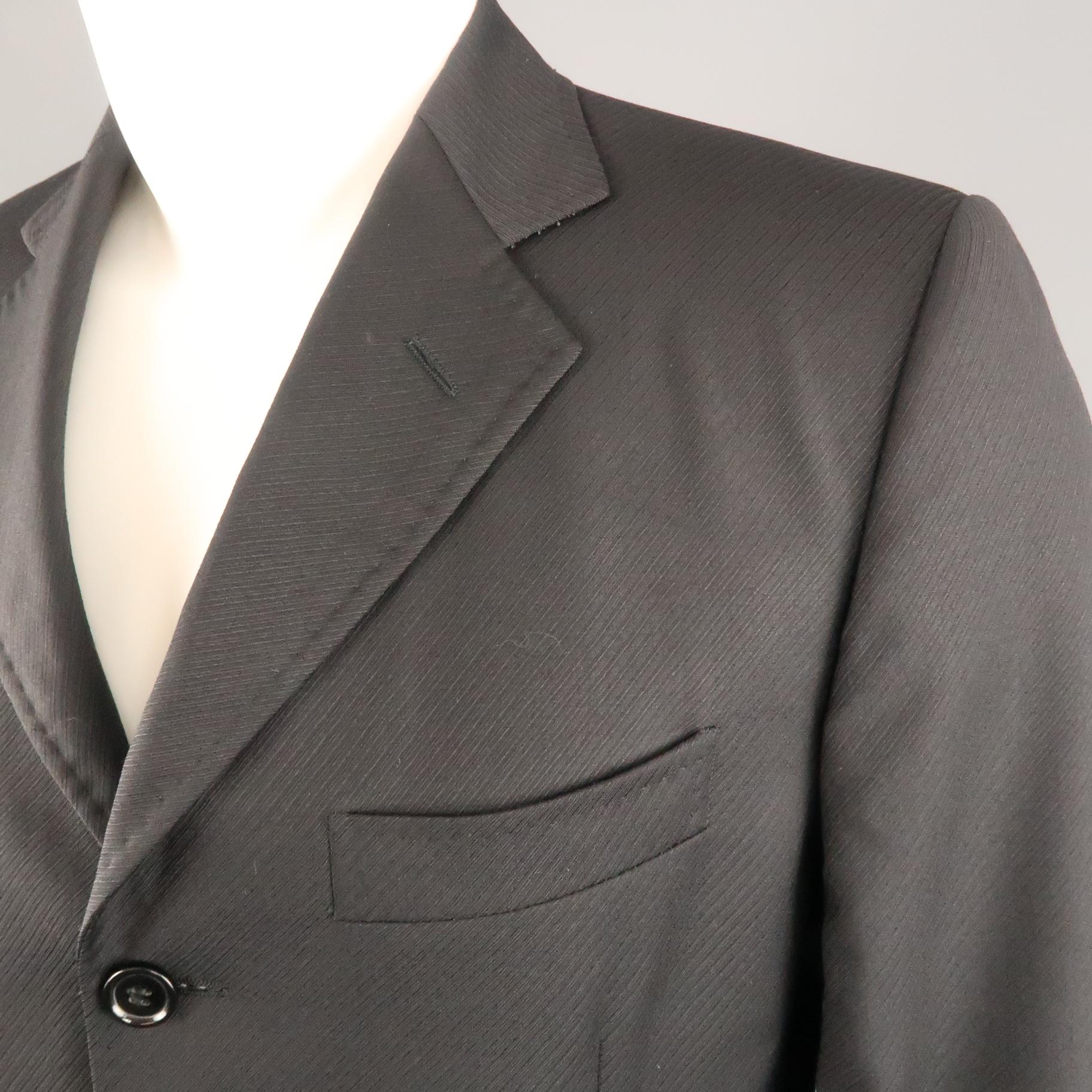 DOLCE & GABBANA sport coat comes in diagonal stripe textured wool with a top stitch notch lapel, single breasted,  three button front, and flap pockets. Made in Italy.
 
Excellent Pre-Owned Condition.
Marked: IT 48
 
Measurements:
 
Shoulder: 17