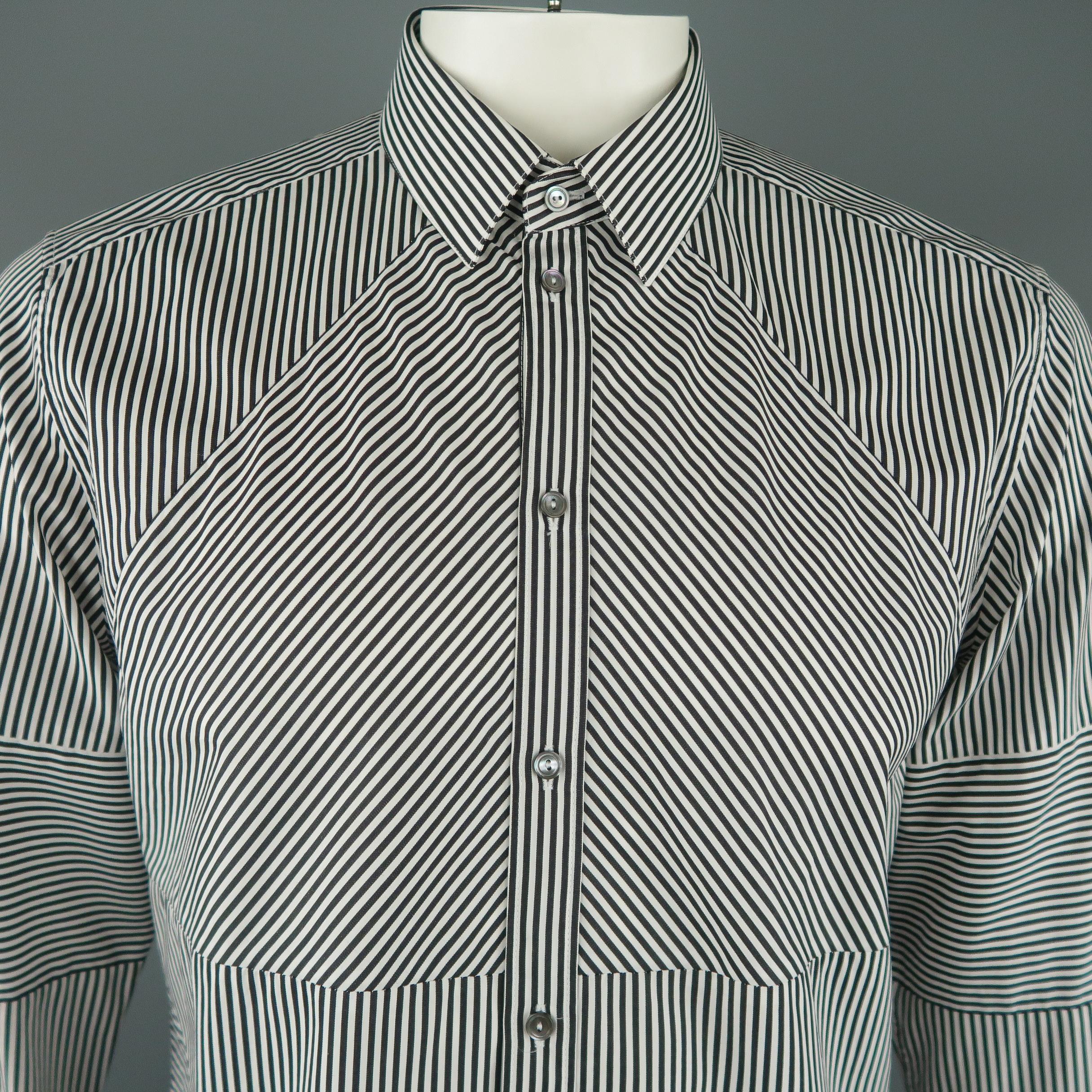 DOLCE & GABBANA dress shirts comes in directional black and white striped patchwork panels with a classic pointed collar. Made in Italy.
 
Excellent Pre-Owned Condition.
Marked: 16 1/2  /  42
 
Measurements:
 
Shoulder: 18 in.
Chest: 44 in.
Sleeve:
