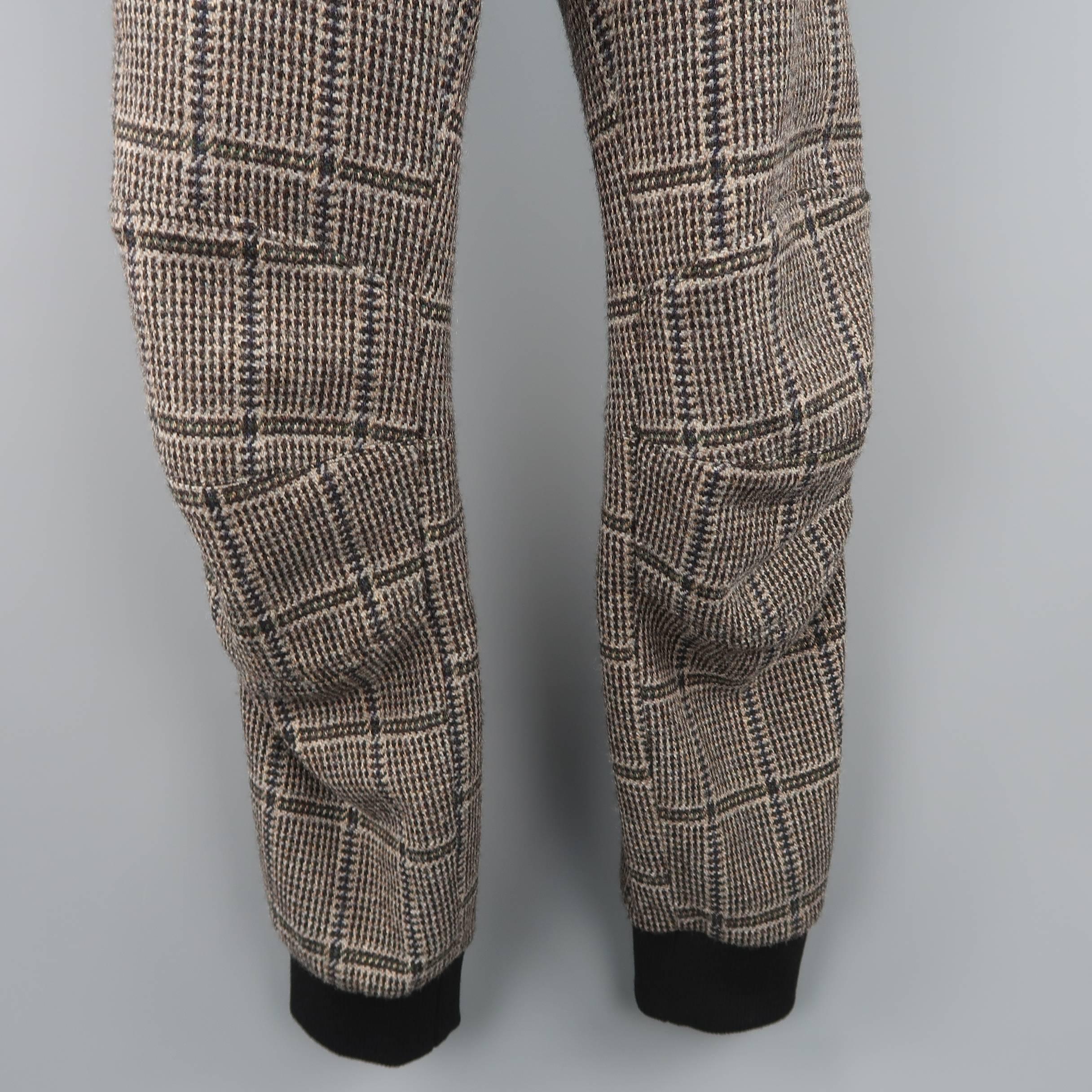 DRIES VAN NOTEN joggers come in a beige glenplaid wool flannel with a drawstring waistband, knee pad panels, and black elastic cuffs. Made in Romania.
 
Good Pre-Owned Condition.
Marked: IT 50
 
Measurements:
 
Waist: 34 in.
Rise: 10 in.
Inseam: 31