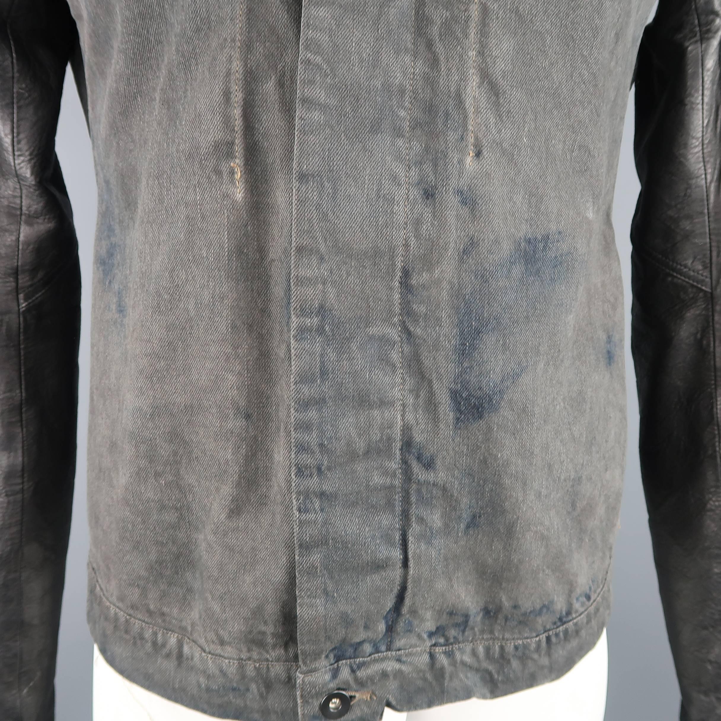 DRKSHDW by RICK OWENS bomber jacket comes in a charcoal gray denim with navy distressed dyed look and features a hidden placket asymmetrical collar and leather zip cuff sleeves with MA-1 pocket. Wear throughout. Made in Italy.
 
Good Pre-Owned