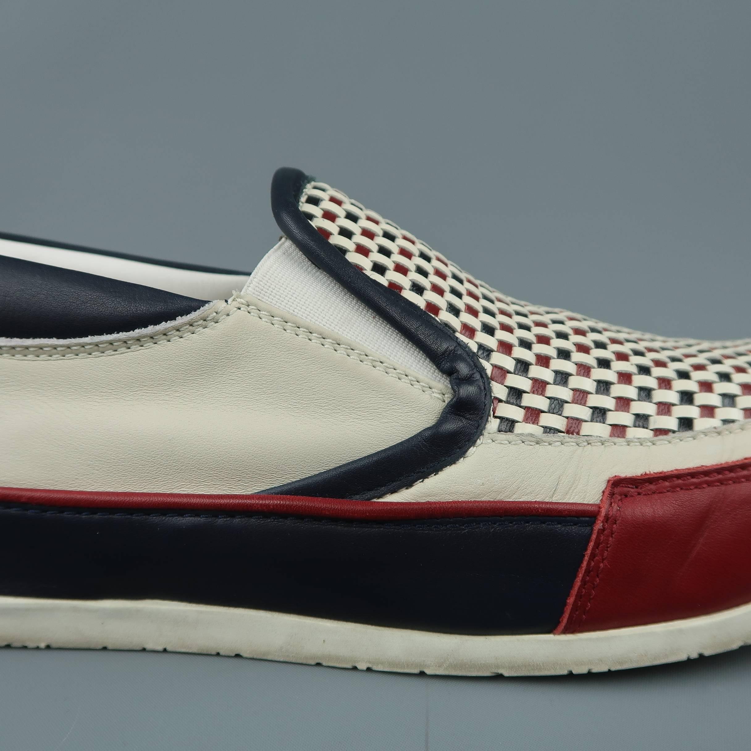 DSUQARED2 slip on sneakers come in cream leather with red, white, and blue woven apron toe and color block panels. Wear throughout. With box. Made in Italy.
 
Fair Pre-Owned Condition.
Marked: IT 46
 
Outsole: 12.5 x 4 in.
