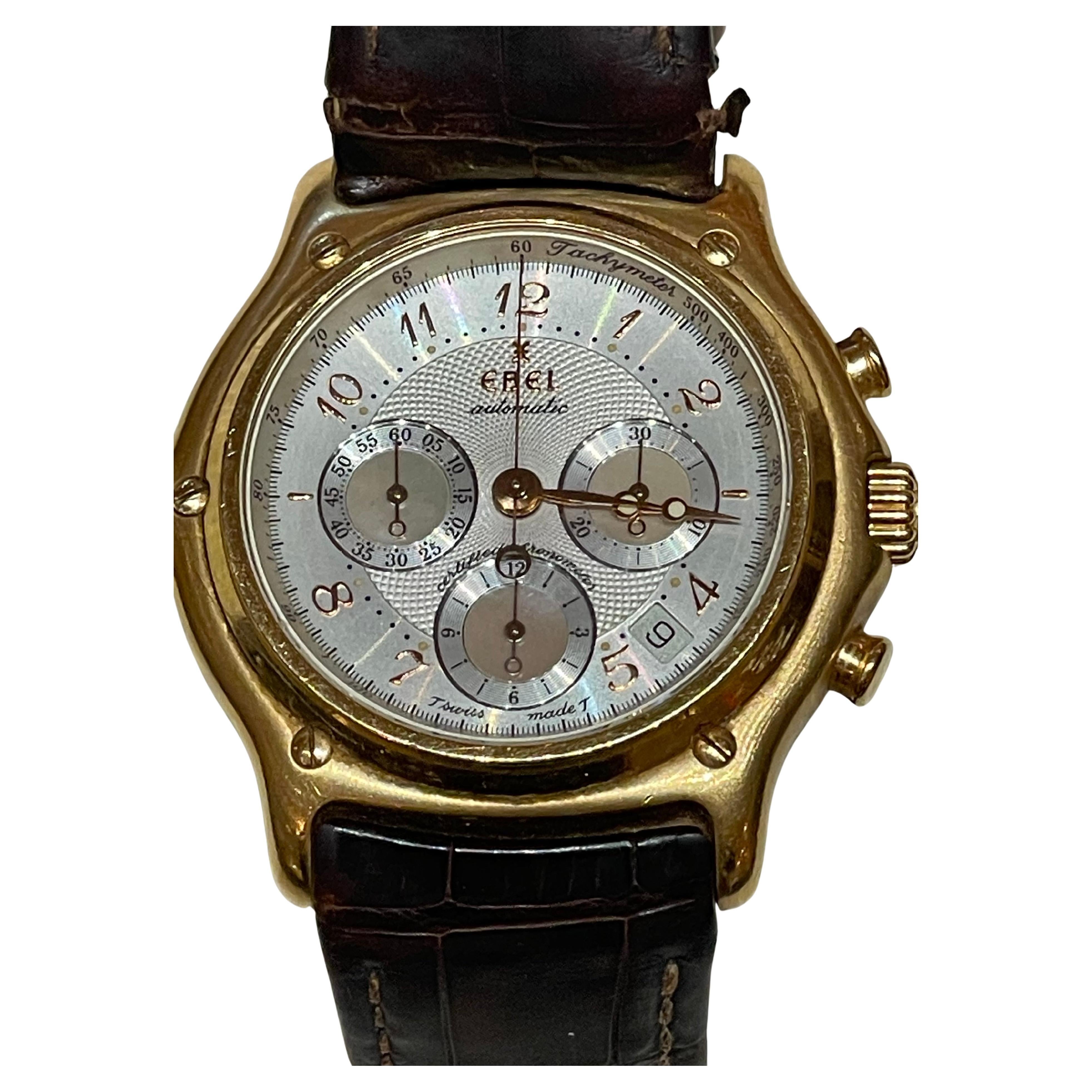 Men's EBEL Wristwatch 1911 Le Modulor Chronograph E5137240, 18kt Rose Gold

Rose gold-tone 18kt rose gold case with a brown leather strap. Fixed rose gold-tone 18kt rose gold bezel. Silver-tone dial with rose gold-tone hands and Arabic numeral hour
