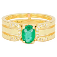 Herrenring mit Smaragd aus 14k Gold.