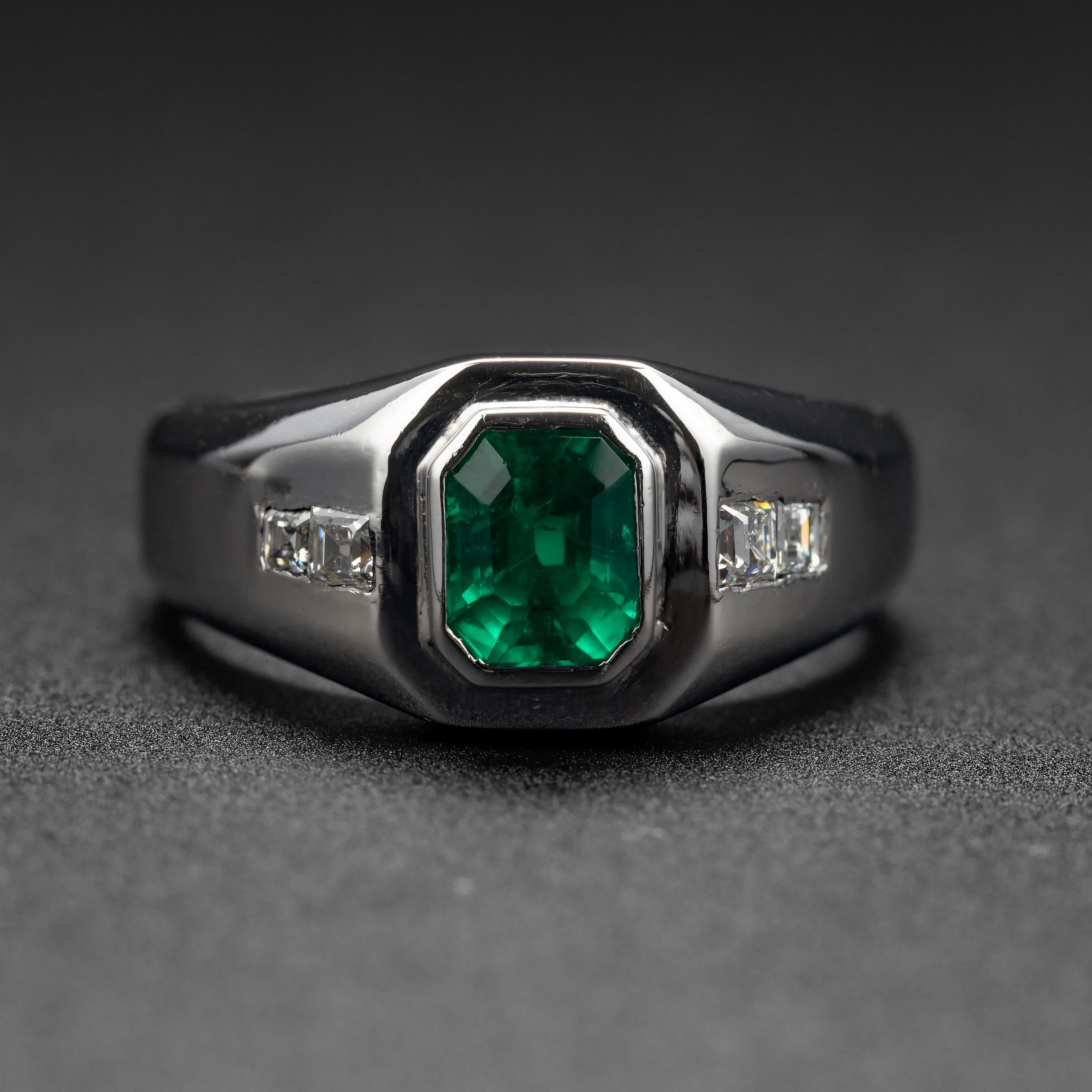 Emerald doesn't come any finer than what you see here in this vintage men's ring. This dense platinum hand-fabricated ring from the mid-1990s features a one-carat emerald-cut emerald of the finest color; a vividly saturated bluish-green that is