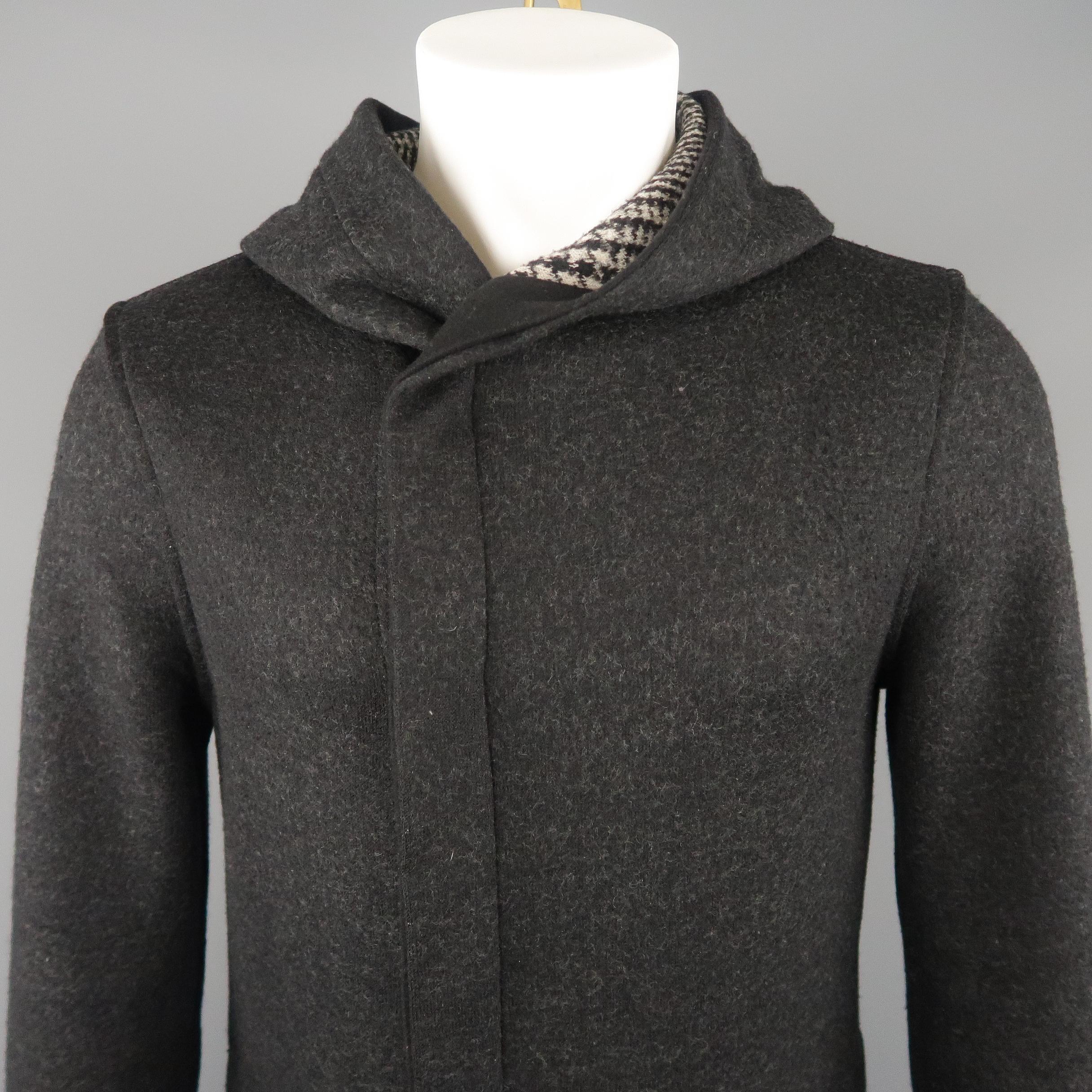 EMPORIO ARMANI coat comes in heather charcoal gray wool bend knit with a double breasted hidden snap closure, inner patch pockets, and hood with houndstooth liner. Made in Romania.
 
Excellent Pre-Owned Condition.
Marked: IT 46
 
Measurements:
