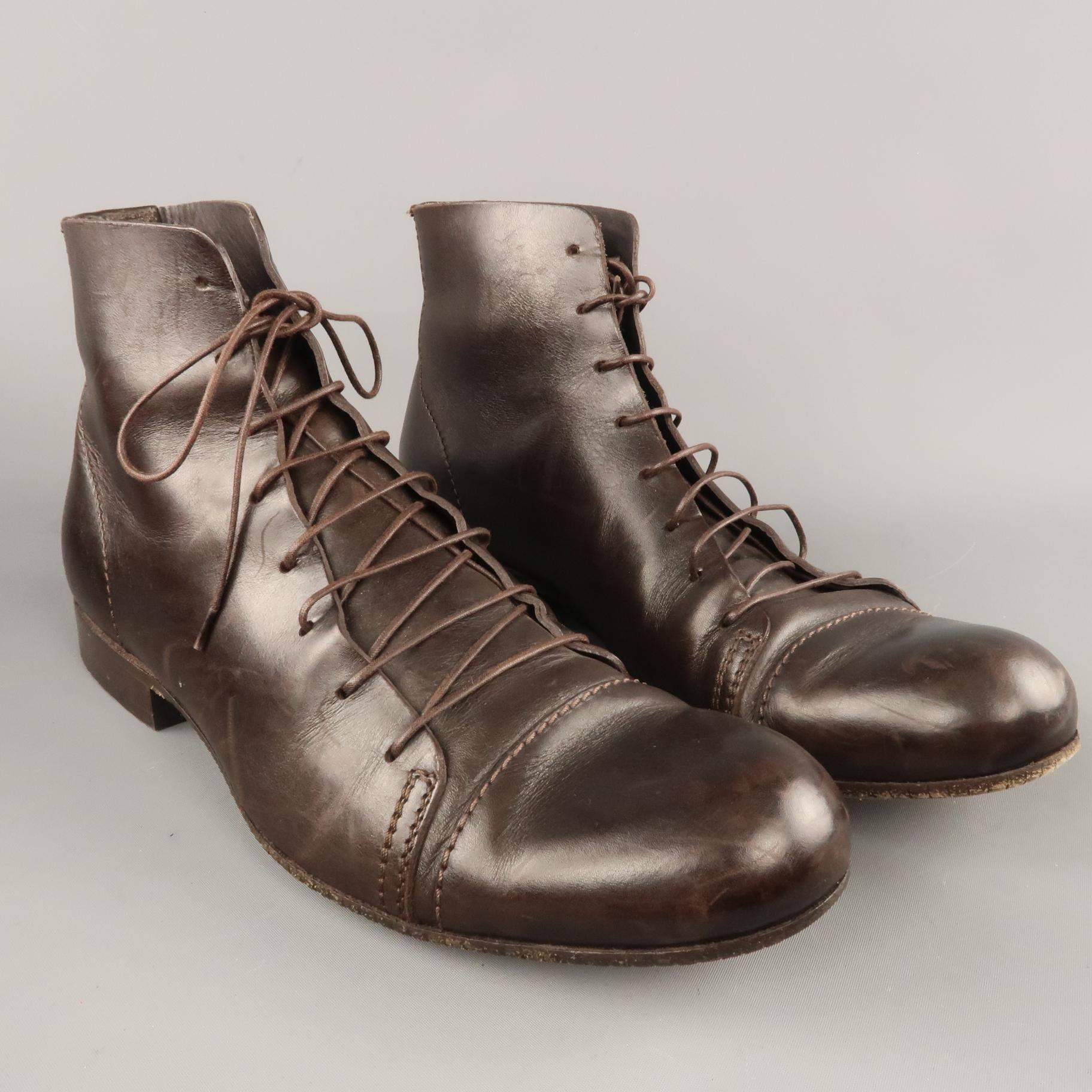 EMPORIO ARMANI ankle boots come in deep brown leather with a round capped toe and lace up front. With box. Made in Italy.
 
Very Good Pre-Owned Condition.
Marked:IT 42
 
Outsole: 11.5 x 4 in.
