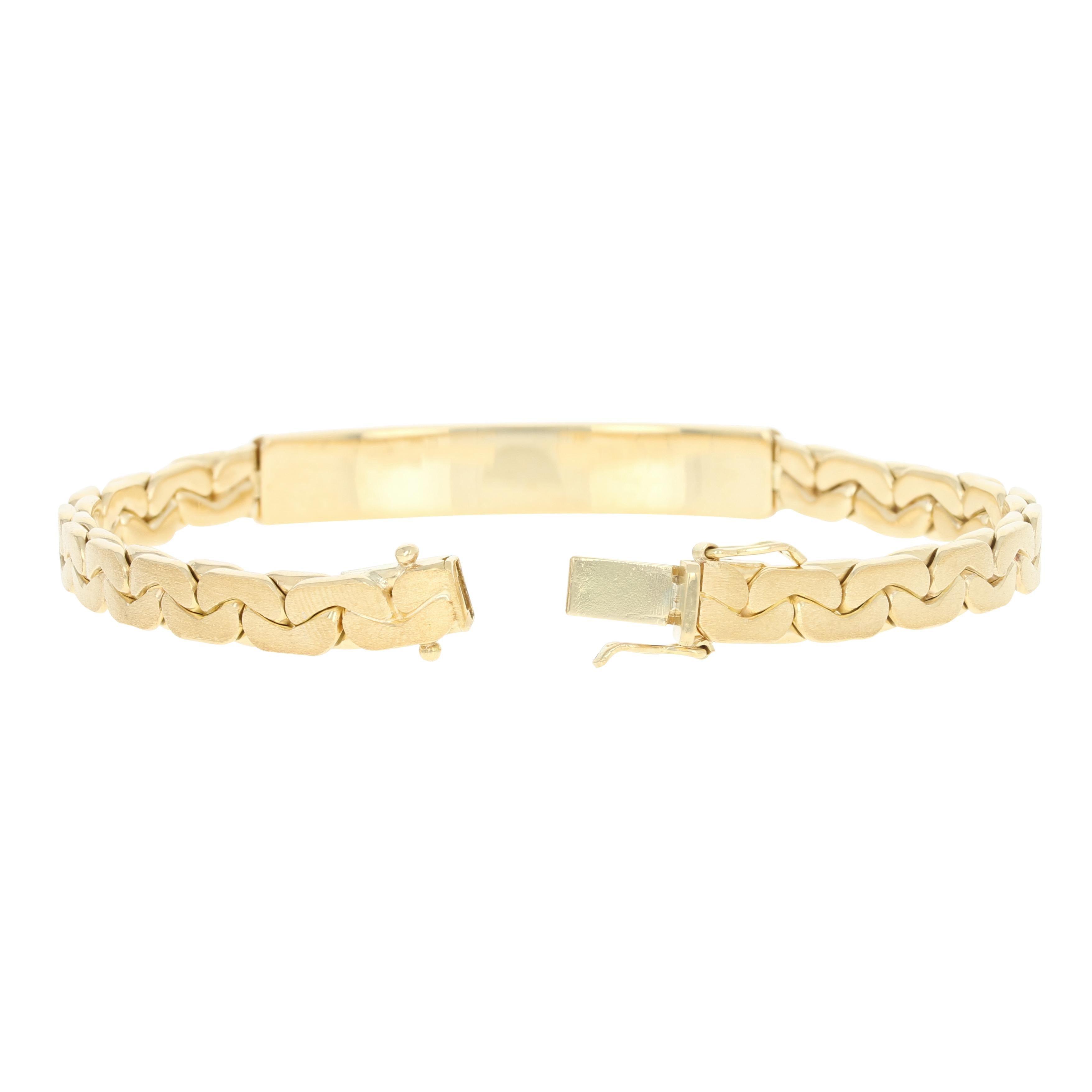 Looking sharp! Featuring a luminous matte finish, this 18k yellow gold identification bracelet displays a curved rectangular bar, which can be engraved by your local jeweler, that is set in the center of the C link chain band.  

Metal Content:
