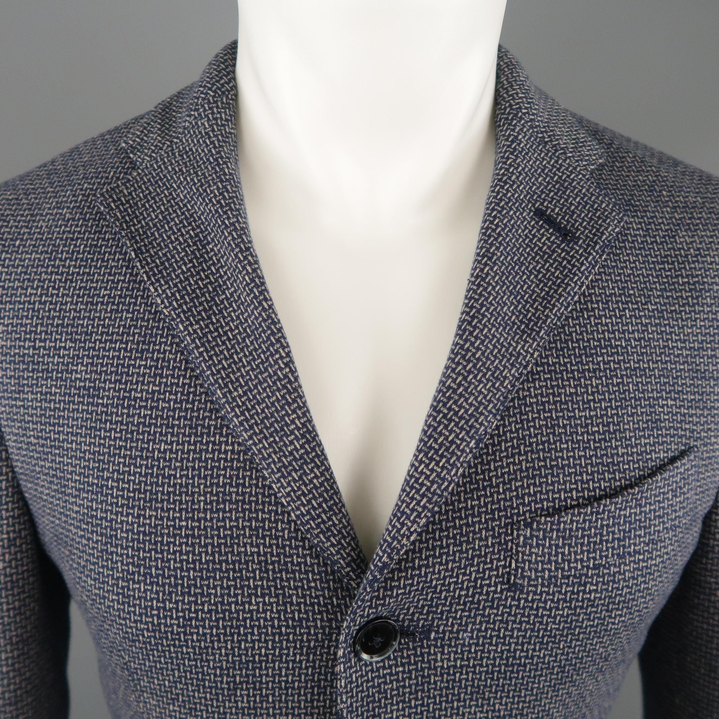 EREDI PISANO sport coat comes in a navy and gray woven print knit with a notch lapel, single breasted three button front, functional button cuffs, and patch pockets. Made in Italy.
 
Excellent Pre-Owned Condition.
Marked: IT 48
 
Measurements:
