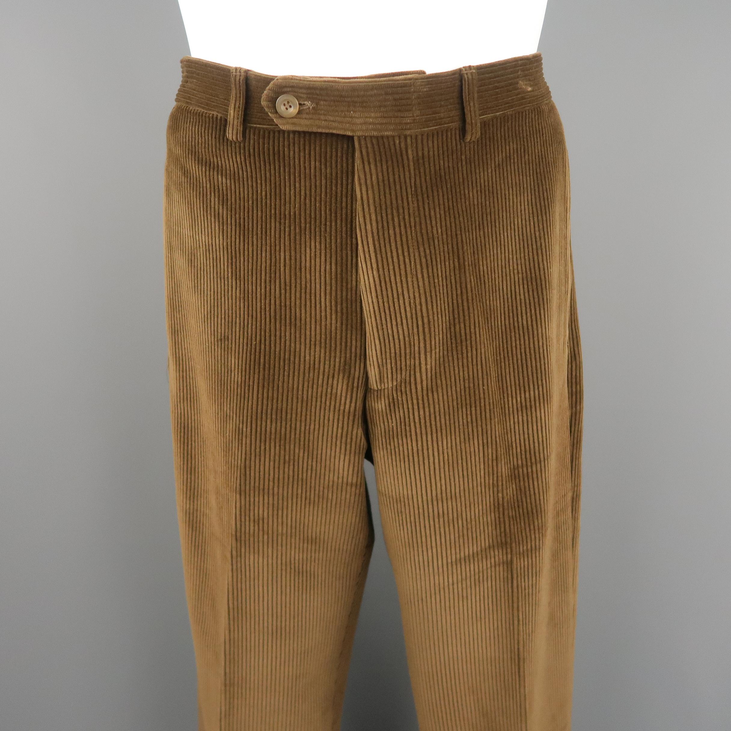ERMENEGILDO ZEGNA pants come in tan brown corduroy with a tab closure waistband and classic fit. Unhemmed.
 
Very Good Pre-Owned Condition.
Marked: 31
 
Measurements:
 
Waist: 32 in.
Rise: 11.5 in.
Inseam:  36 in.