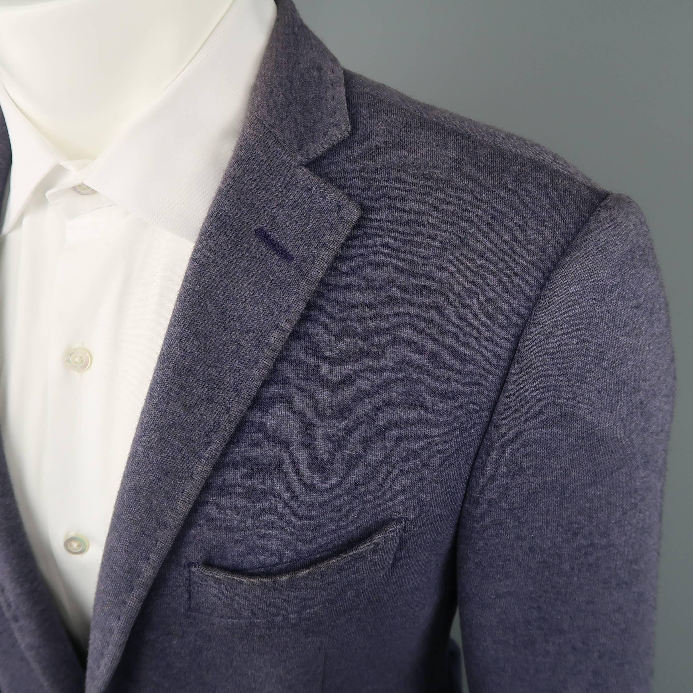 Single breasted ETRO sport coat comes in a navy blue textured mohair wool blend fabric with a two button closure, functional button cuffs , faille piping throughout, and paisley print silk liner.  Made in Italy.
 
Excellent Pre-Owned