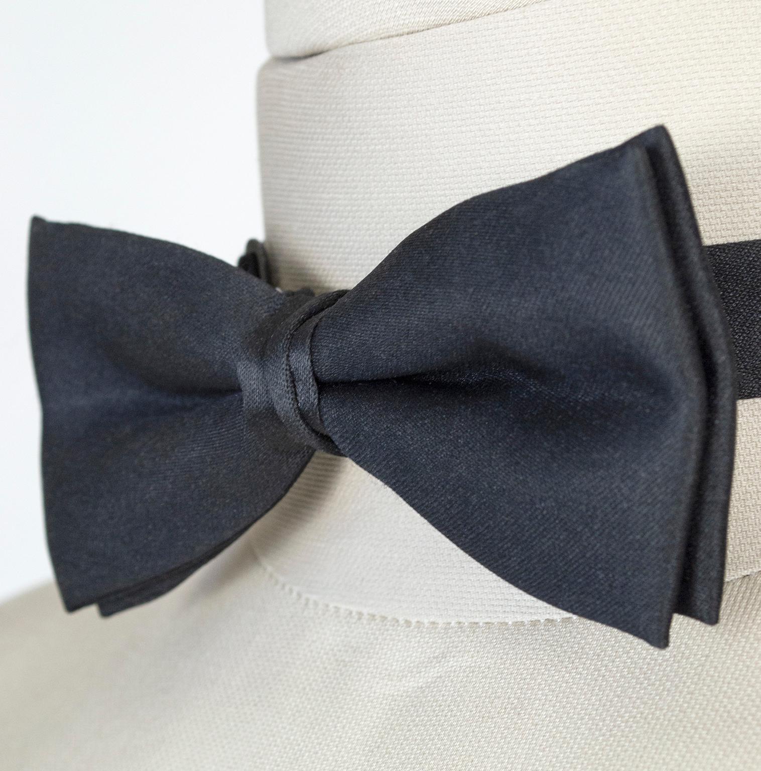 Does the thought of a black tie affair cause you enough angst without the added stress of tying your own bow tie? This pre-tied version will have you dressed and ready in a snap. Pair it with our vintage ivory dinner jacket (listed separately) and