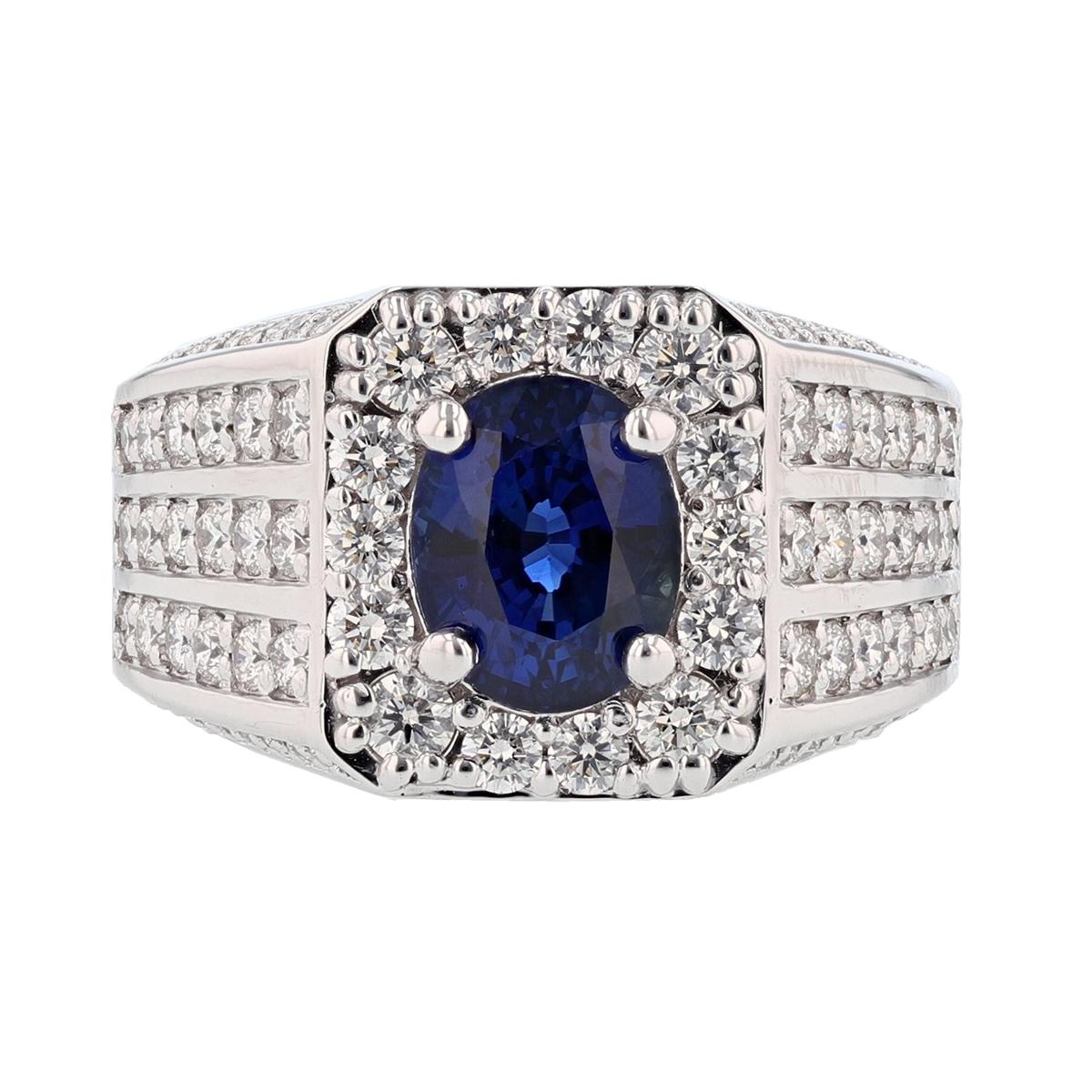 This gent's ring is made in 14 karat white gold featuring one oval cut, GIA certified, Natural Blue Ceylon Sri Lankan Sapphire weighing 4.00 ct that is prong set. The certificate number is GIA 6207469237. The ring features 90 round cut diamonds,