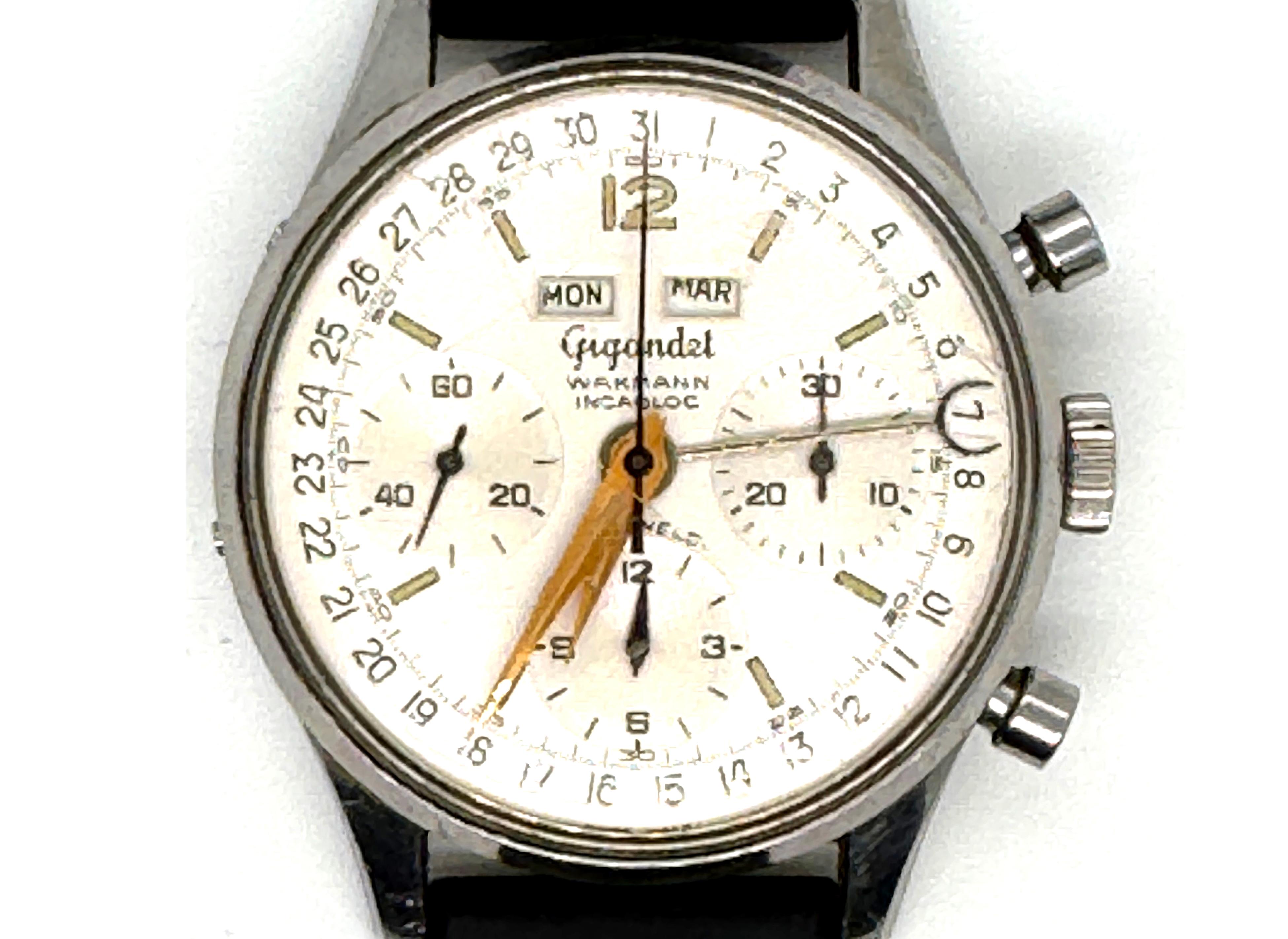 Mens Gigandet Wakmann Datic Triple Date Chronograph Watch Incabloc Black Rubber Band


Rare Genuine Vintage Gigandet Wakmann Watch with Collectible Triple Date Complication

Triple Date: Day, Date, and Month (All Functions Working