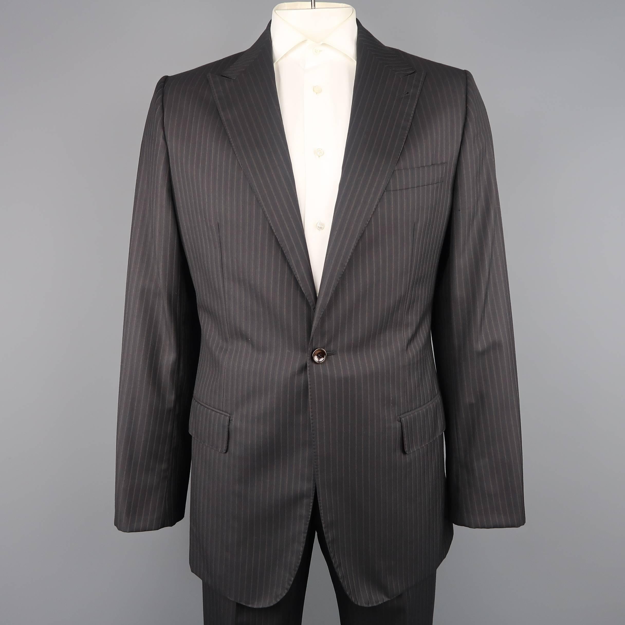 GIORGIO ARMANI suit comes in charcoal micro windowpane print wool and includes a single breasted, two button, notch lapel sport coat and matching flat front trousers.  Custom Made in Italy.
 
Good Pre-Owned Condition.
Marked: IT 52
 
Measurements:
