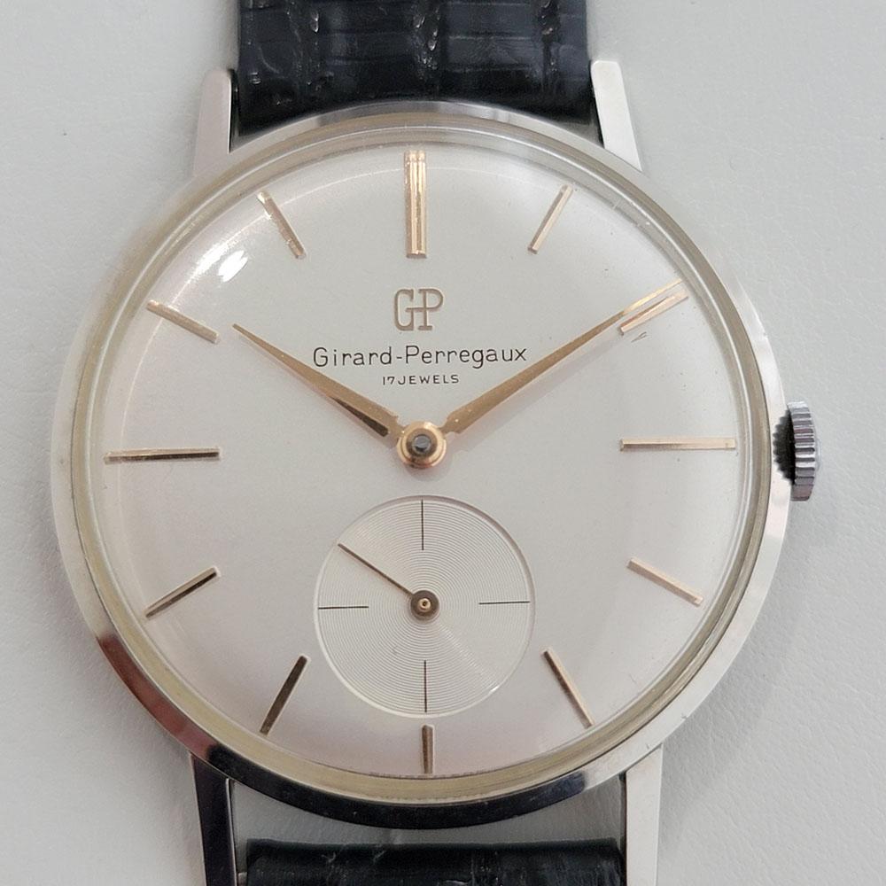 Timeless classic, Men's Girard Perregaux manual wind dress watch, c.1980s, NOS, all original. Verified authentic by a master watchmaker. Gorgeous, untouched Girard Perregaux signed dial, rose gold indice hour markers, rose gold minute and hour
