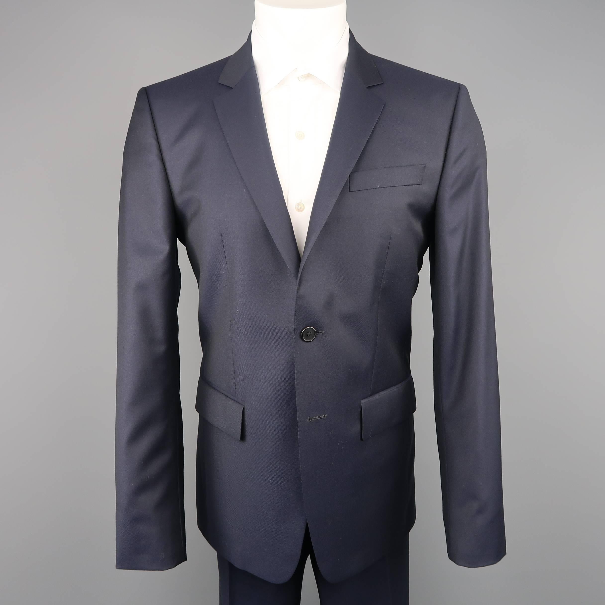 Two piece GIVENCHY by RICCARDO TISCI suit comes in navy blue wool twill and includes a two button, notch lapel sport coat with signature cross stitch back and matching flat front trousers. Made in Bulgarie.
 
Excellent Pre-Owned Condition.
Marked: