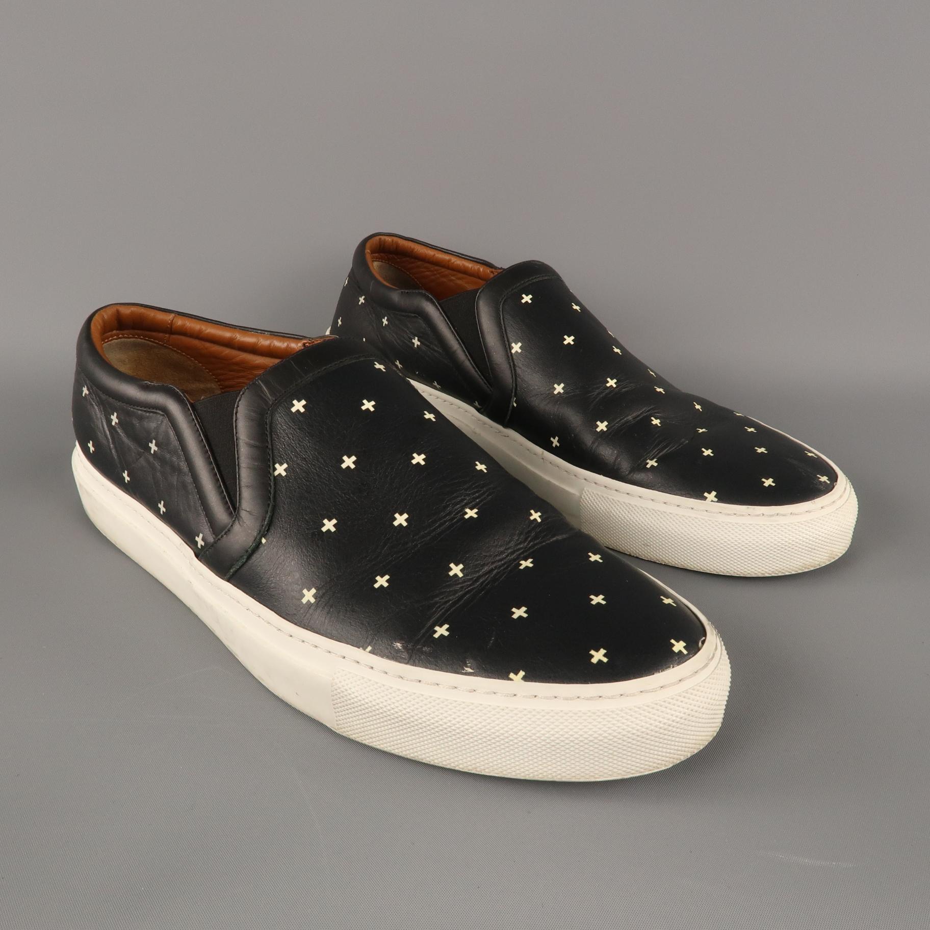 GIVENCHY Slip on Sneakers comes in black and white tones in a cross printed leather material, with a white rubber sole. Made in Italy.
 
Very Good Pre-Owned Condition.
Marked: IT 44
 
Outsole: 12.5 x 4.5 in.