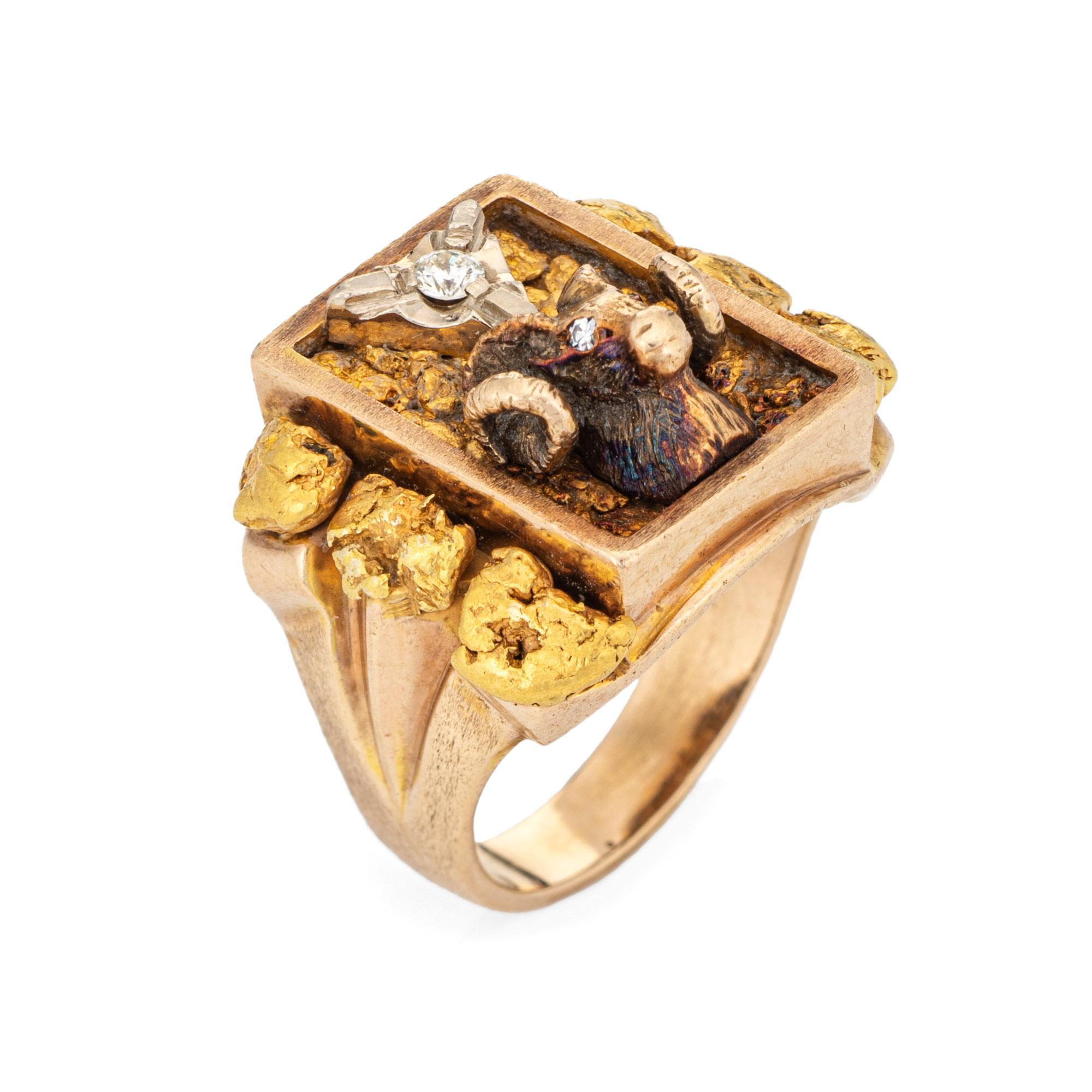 Finely detailed vintage natural gold nugget Rams head ring (circa 1960s to 1970s) crafted in 10 karat yellow gold (22k to 24k gold nuggets). 

One estimated 0.10 carat round brilliant cut diamond is estimated at H-I color and SI1 clarity. 

The