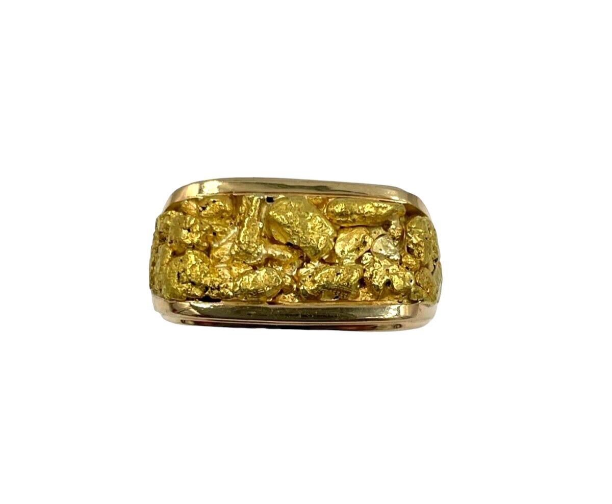 Men’s gold Nugget Yellow Gold Saddle ring, Size 13, circa 1970s. 
  This is a unique ring which is easy to wear, low profile.

GOLD: Nuggets are 20k gold and the rest is 14k yellow gold.

WEIGHT: 20.3 grams 

DIMENSIONS:  23 mm wide across the