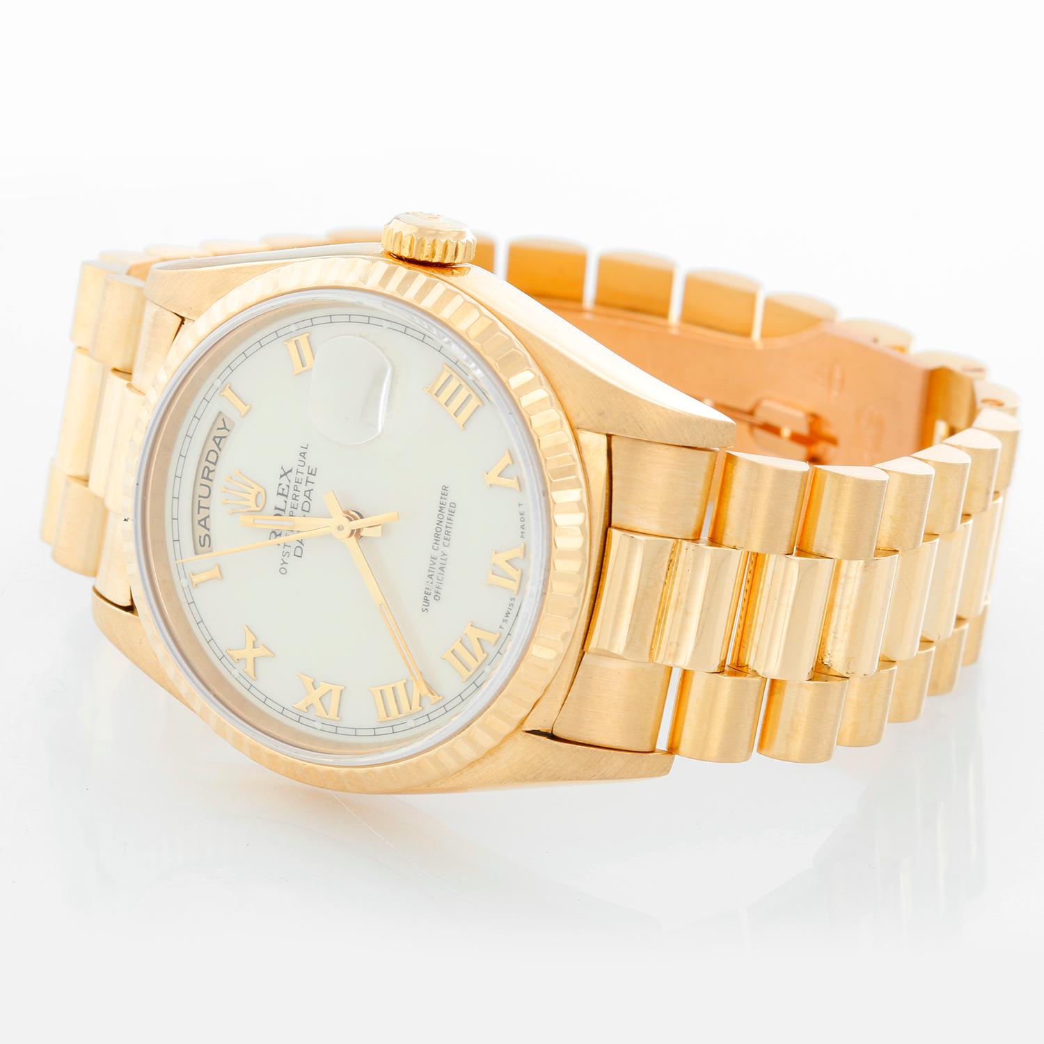 Men's Gold Rolex President Day-Date Watch 18238 - Automatic winding, 31 jewels, double Quickset, sapphire crystal. 18k yellow gold case and fluted bezel (36mm diameter). Cream dial with Roman numerals. 18k yellow gold President bracelet. Pre-owned