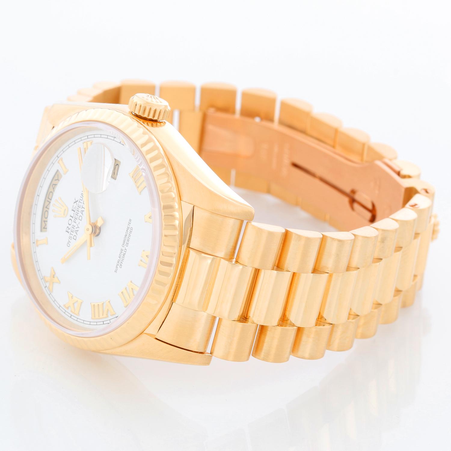 Men's Gold Rolex President Day-Date Watch 18238 - Automatic winding, 31 jewels, double Quickset, sapphire crystal. 18k yellow gold case and fluted bezel (36mm diameter). White dial with Roman numerals . 18k yellow gold President bracelet. Pre-owned
