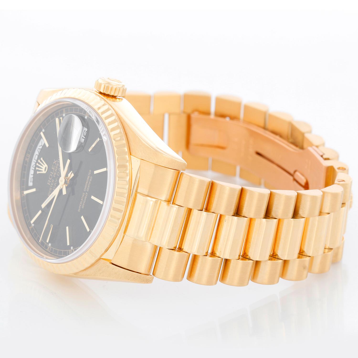 Men's Gold Rolex President Day-Date Watch 18238 - Automatic winding, 31 jewels, double Quickset, sapphire crystal. 18k yellow gold case and fluted bezel (36mm diameter). Black dial with stick hour markers. 18k yellow gold President bracelet.