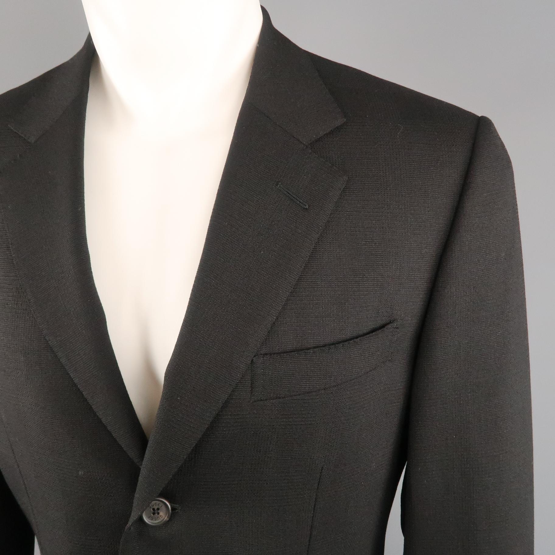 GUCCI sport coat comes in glenplaid textured wool mohair blend fabric with a notch lapel, single breasted,  three button front, and flap pockets. Made in Italy.
 
Excellent Pre-Owned Condition.
Marked: IT 46
 
Measurements:
 
Shoulder: 18 in.
Chest: