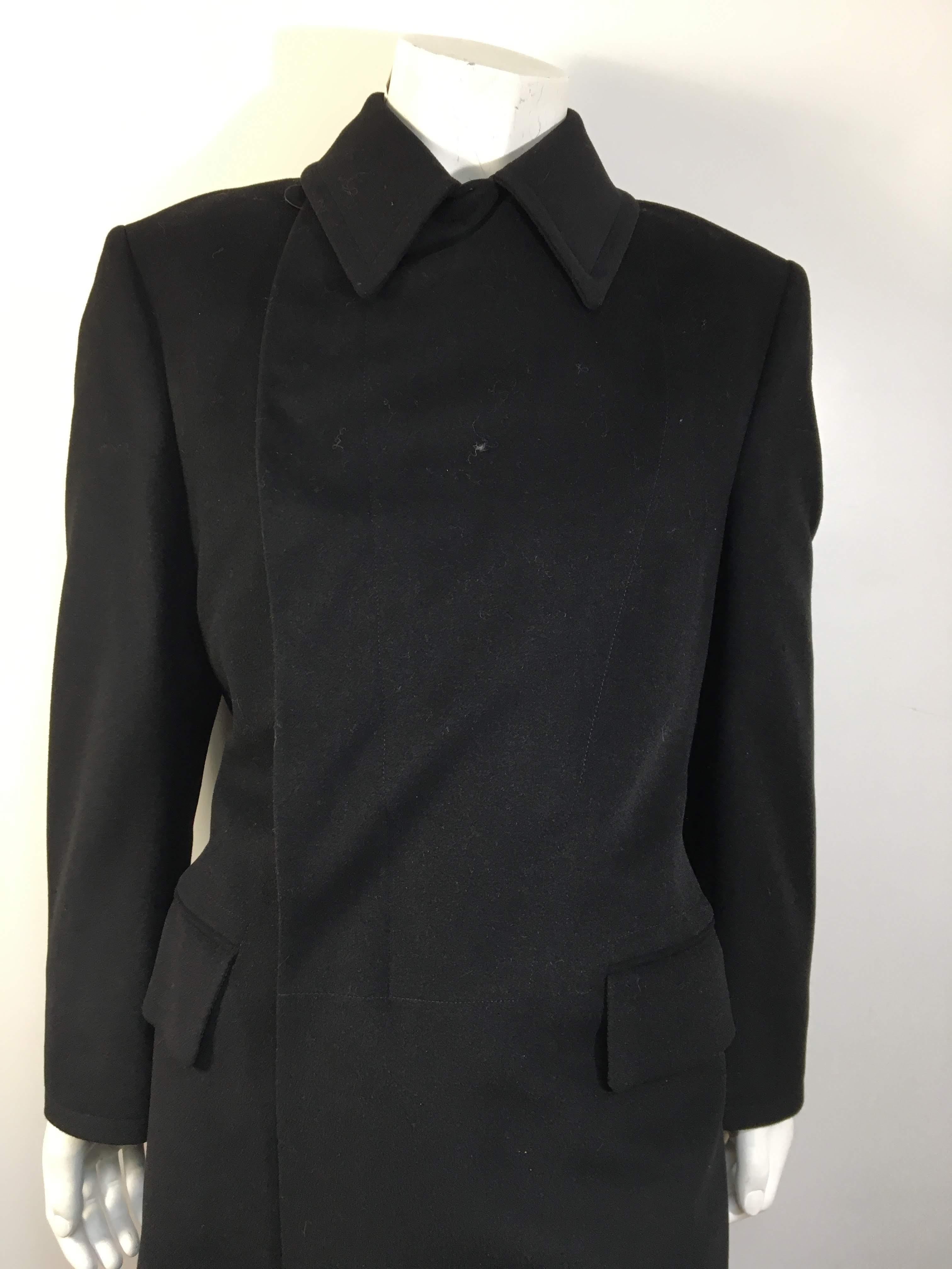 Men's Gucci Black 85% Wool & 15% Cashmere Full Length Trench Coat with 2 Waist Pockets and Buttoned Waist Band at Back
Italian size 48 equates to a Mens Small.