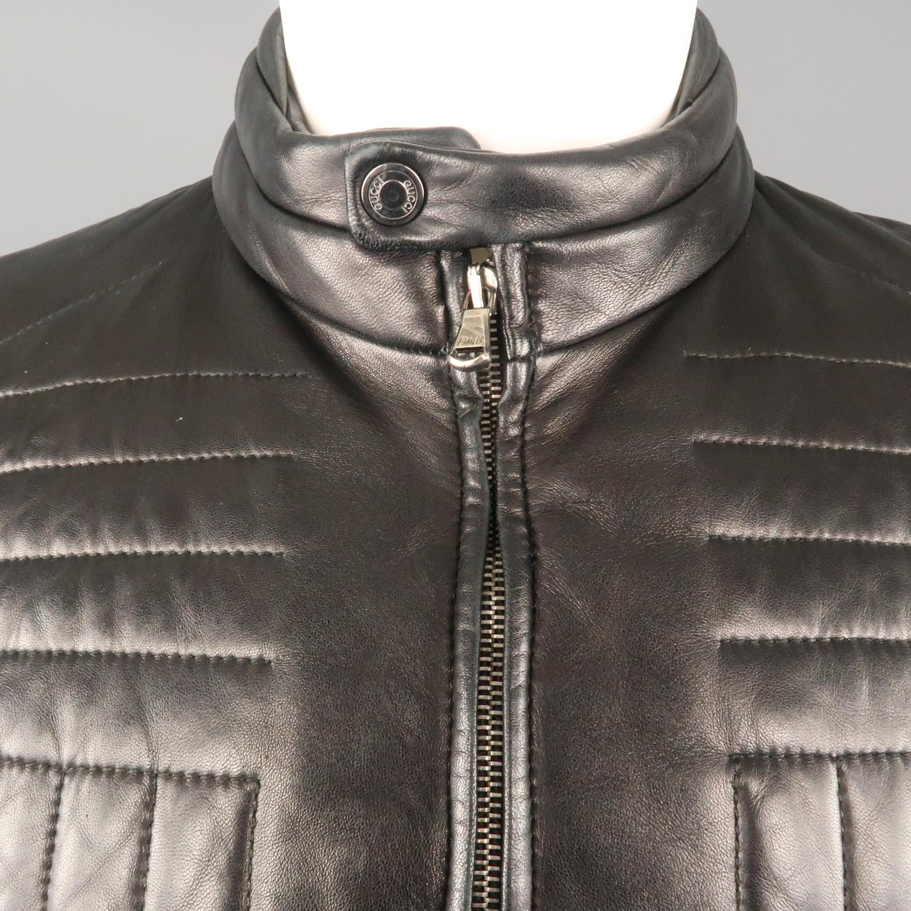 Archive GUCCI by TOM FORD motorcycle jacket comes in smooth black leather with a band snap collar, double zip front, and directional quilting details. With tag. Made in Italy.
 
Very Good Pre-Owned Condition.
Marked: IT 48
 
Measurements:
