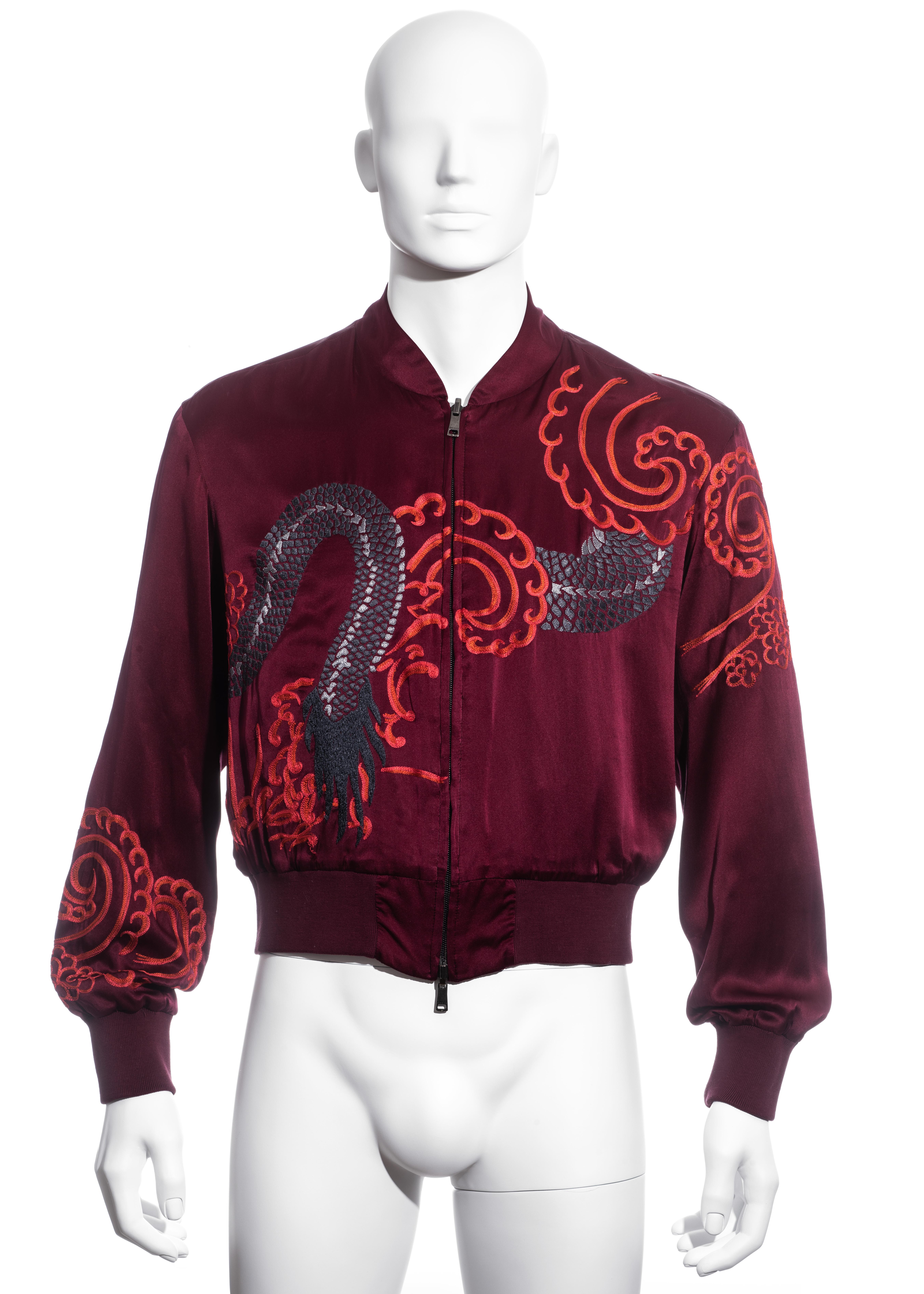 ▪ Men's Gucci red silk bomber jacket 
▪ Designed by Tom Ford
▪ Chinese style dragon embroidery 
▪ Double-ended front zipper 
▪ Reversible; solid colour on other side
▪ Size 48 
▪ Spring-Summer 2001 