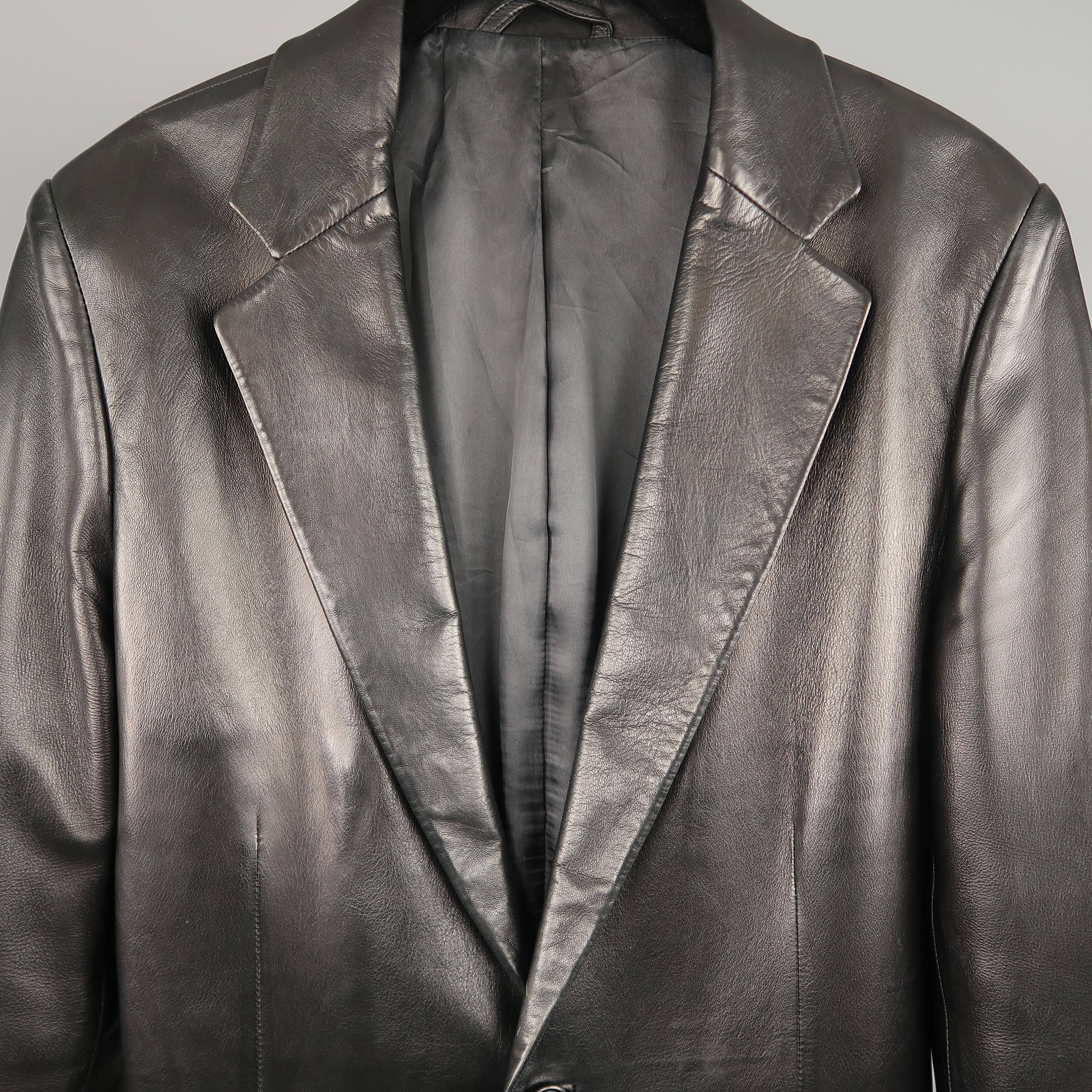 GUCCI by TOM FORD Spring Summer 2001 Collection sport coat jacket comes in smooth black leather with a single breasted two button front, notch lapel, and functional button cuffs. Made in Italy.
 
Good Pre-Owned Condition.
Marked: IT 48

