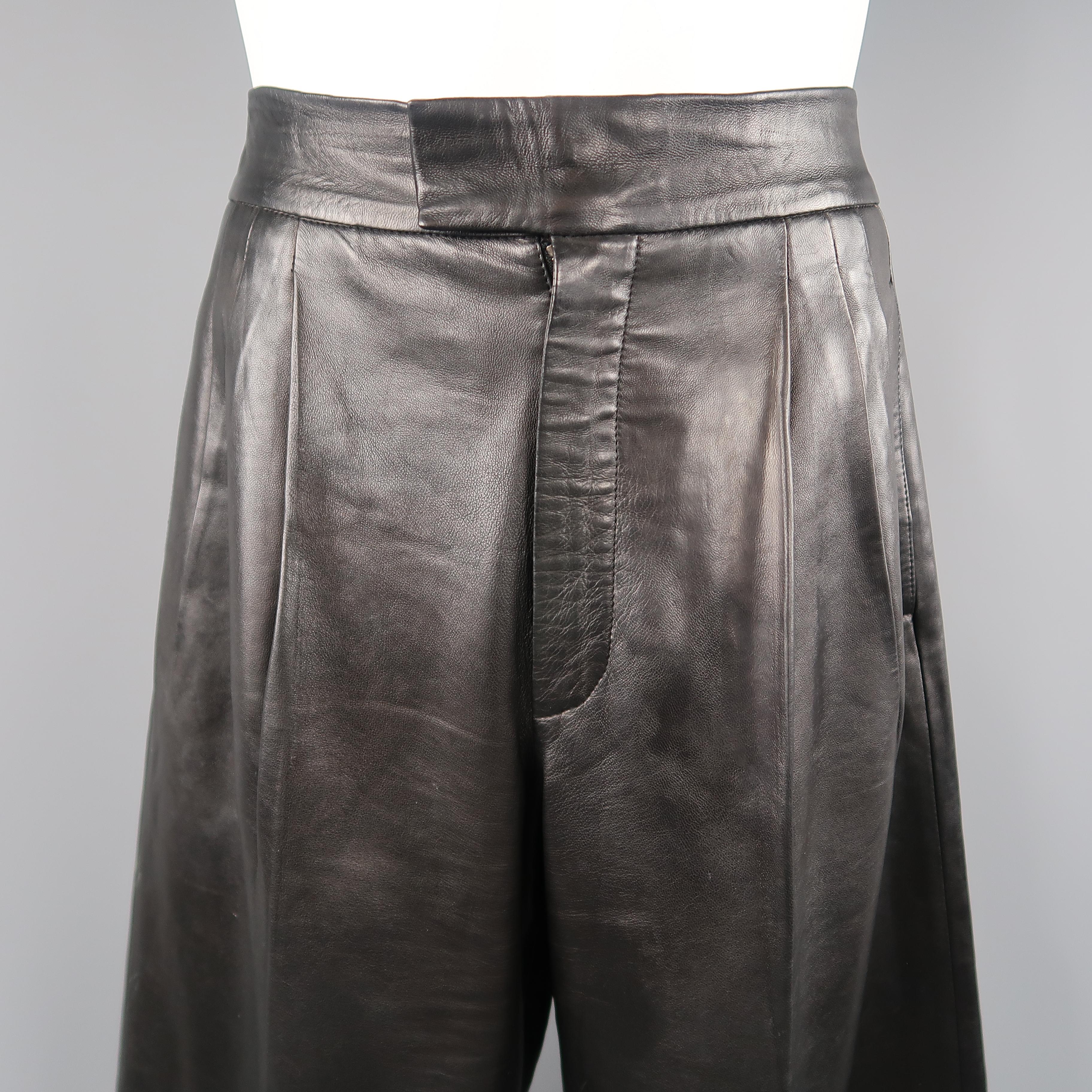 GUCCI by TOM FORD Spring Summer  2001 Collection pants come in smooth black leather and feature a tab closure waistband, zip fly, and wide leg with triple pleat. Wear throughout leather. As-is. Made in Italy.
 
Good Pre-Owned Condition.
Marked: IT