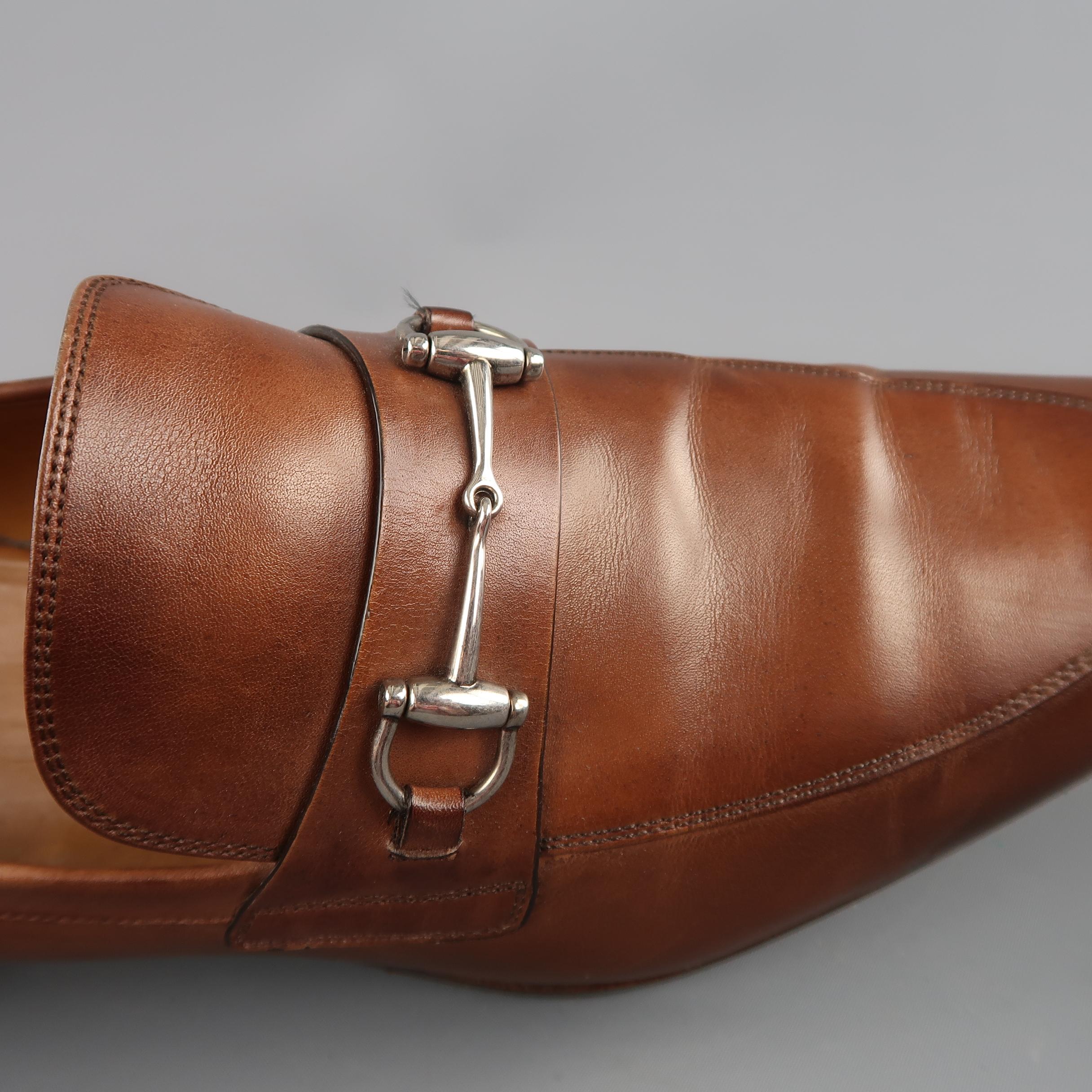 GUCCI loafers come in antique tan brown leather with a subtle ombre. pointed apron toe, and strap with silver tone horsebit hardware. Made in Italy.
 
Good Pre-Owned Condition.
Marked: UK 10
 
Outsole: 12.5 x 4 in.