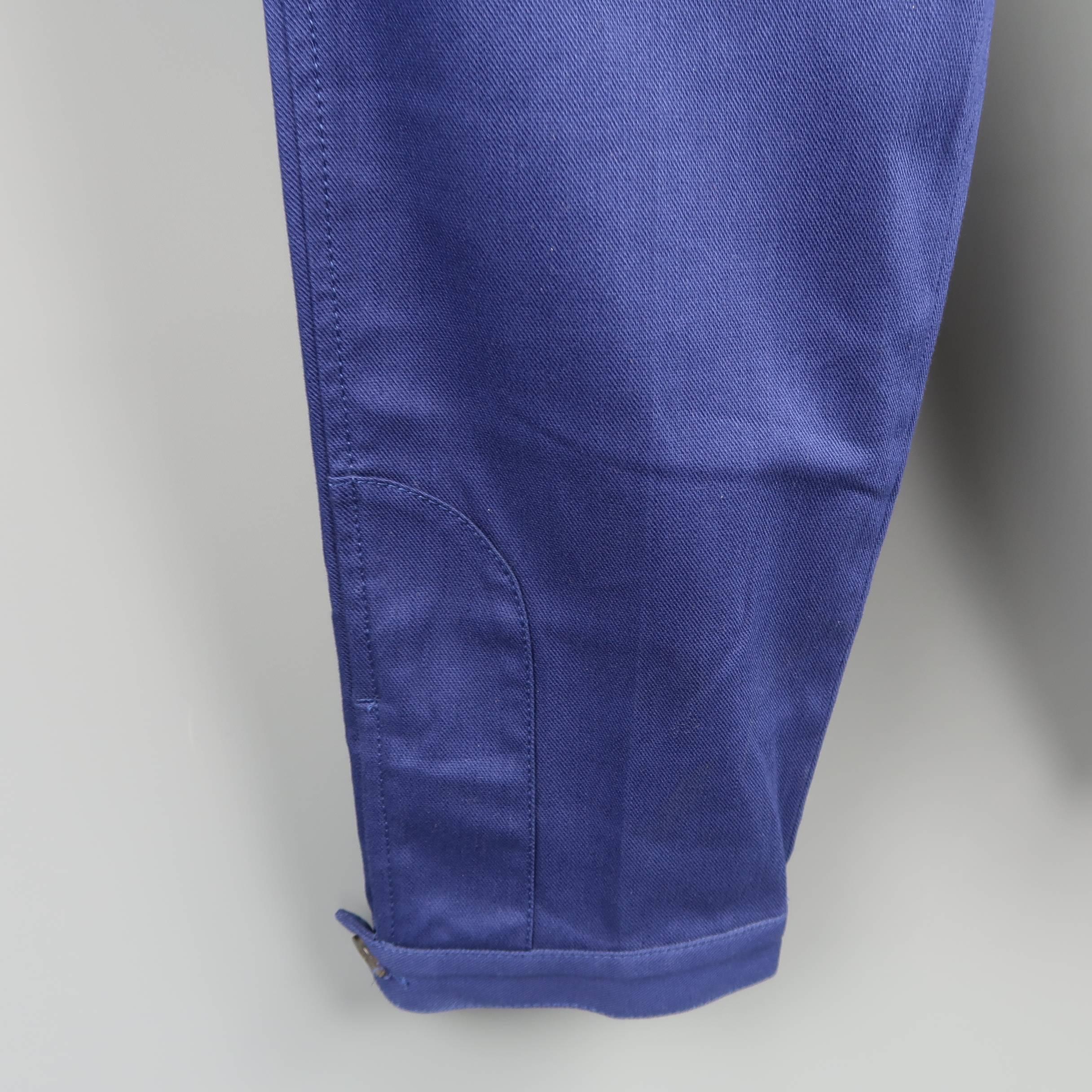 GUCCI jeans come in a royal blue cotton twill with a relaxed fit and moto cuff button hem. Wear throughout. As-is. Made in Italy.
 
Fair Pre-Owned Condition.
Marked: IT 48
 
Measurements:
 
Waist: 33 in.
Rise: 10 in.
Inseam: 30 in.
