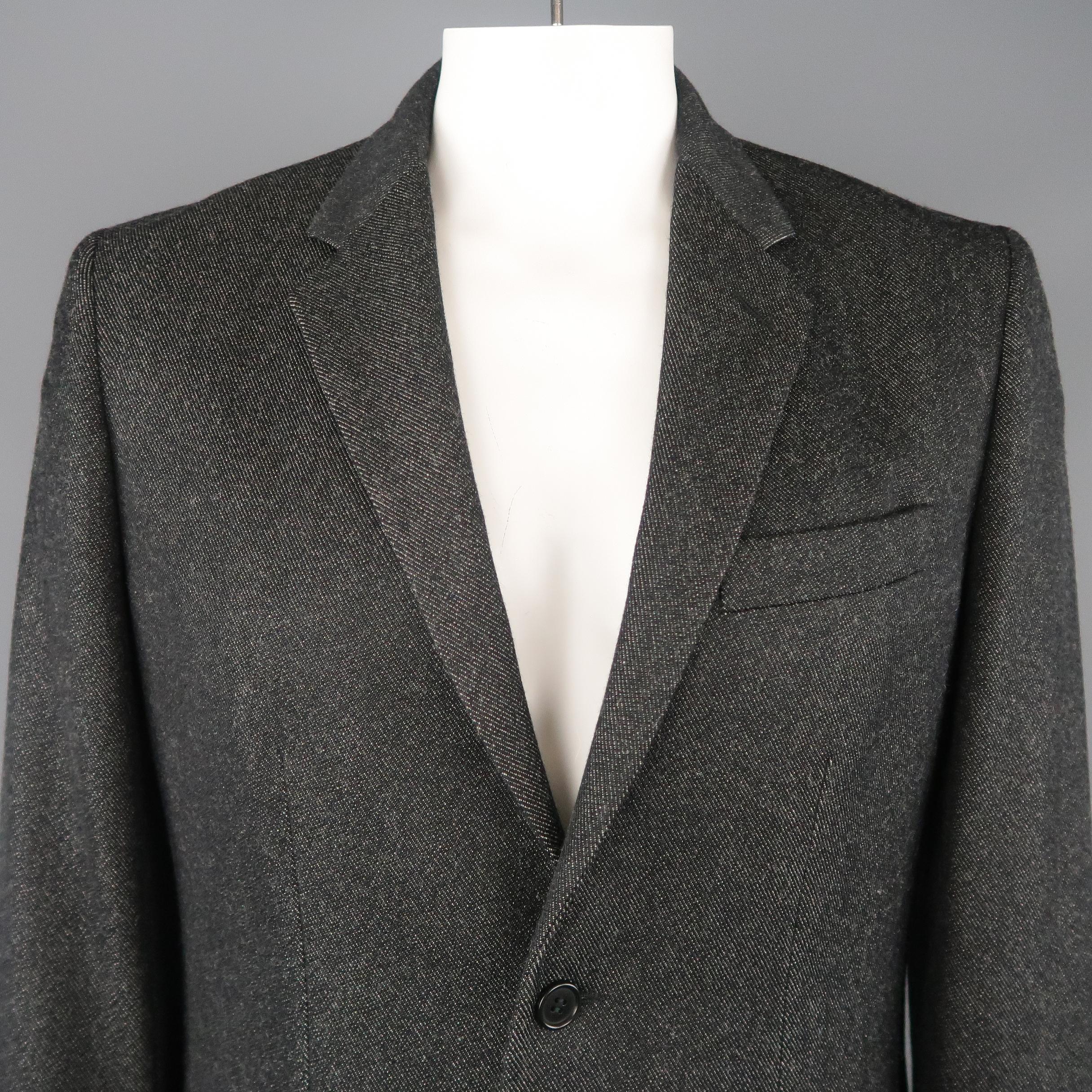 HELMUT LANG sport coat comes in charcoal textured wool twill with a notch lapel, single breasted two button front, and flap pockets. Made in Italy.
 
Excellent Pre-Owned Condition.
Marked: IT 52
 
Measurements:
 
Shoulder: 18 in.
Chest: 46