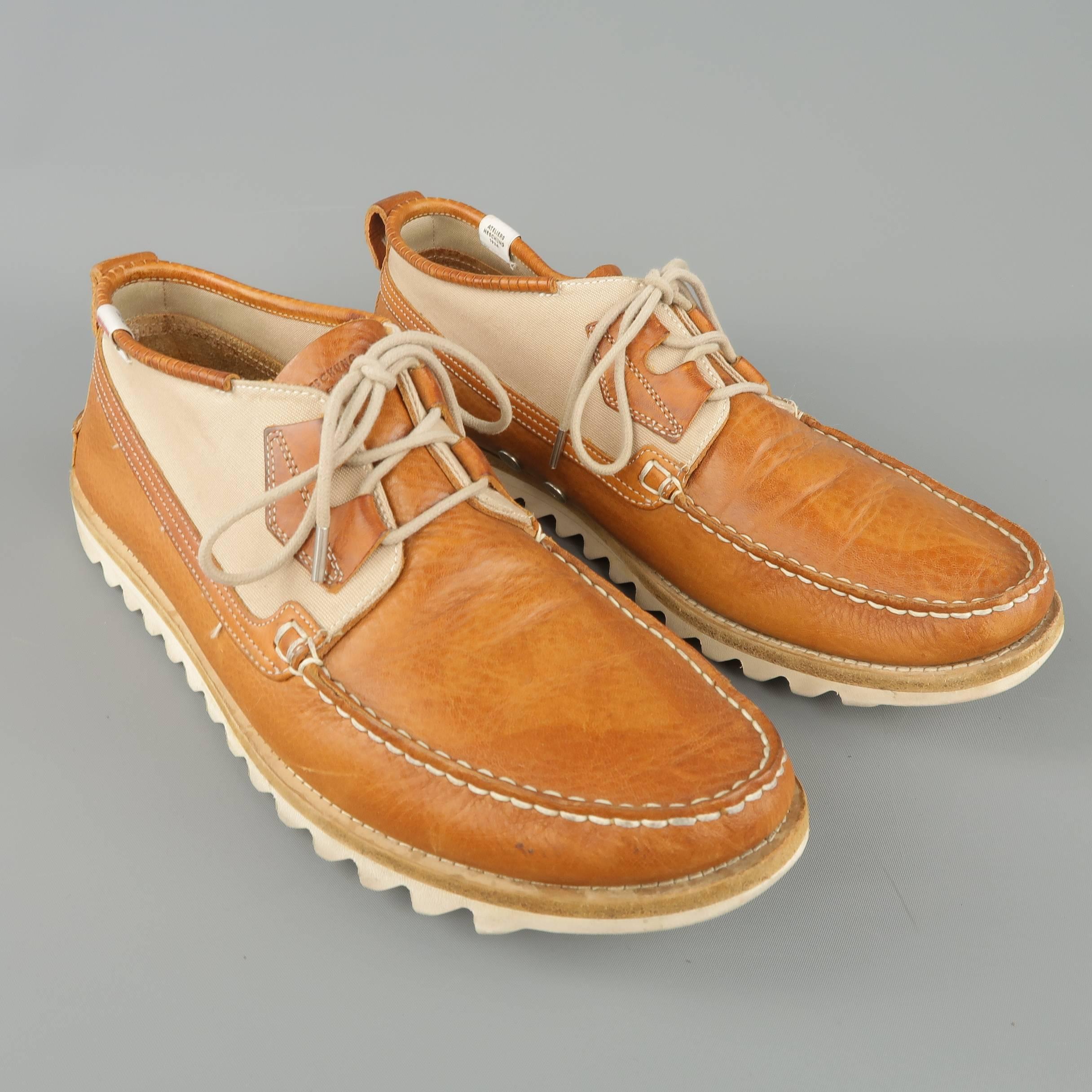 HESCHUNG boat shoe comes in tan leather with an apron toe, canvas panel, and white shark sole. Wear throughout. As-is. Made in France.
 
Fair Pre-Owned Condition.
Marked: UK 8.5
 
Outsole: 12 x 4.25 in.