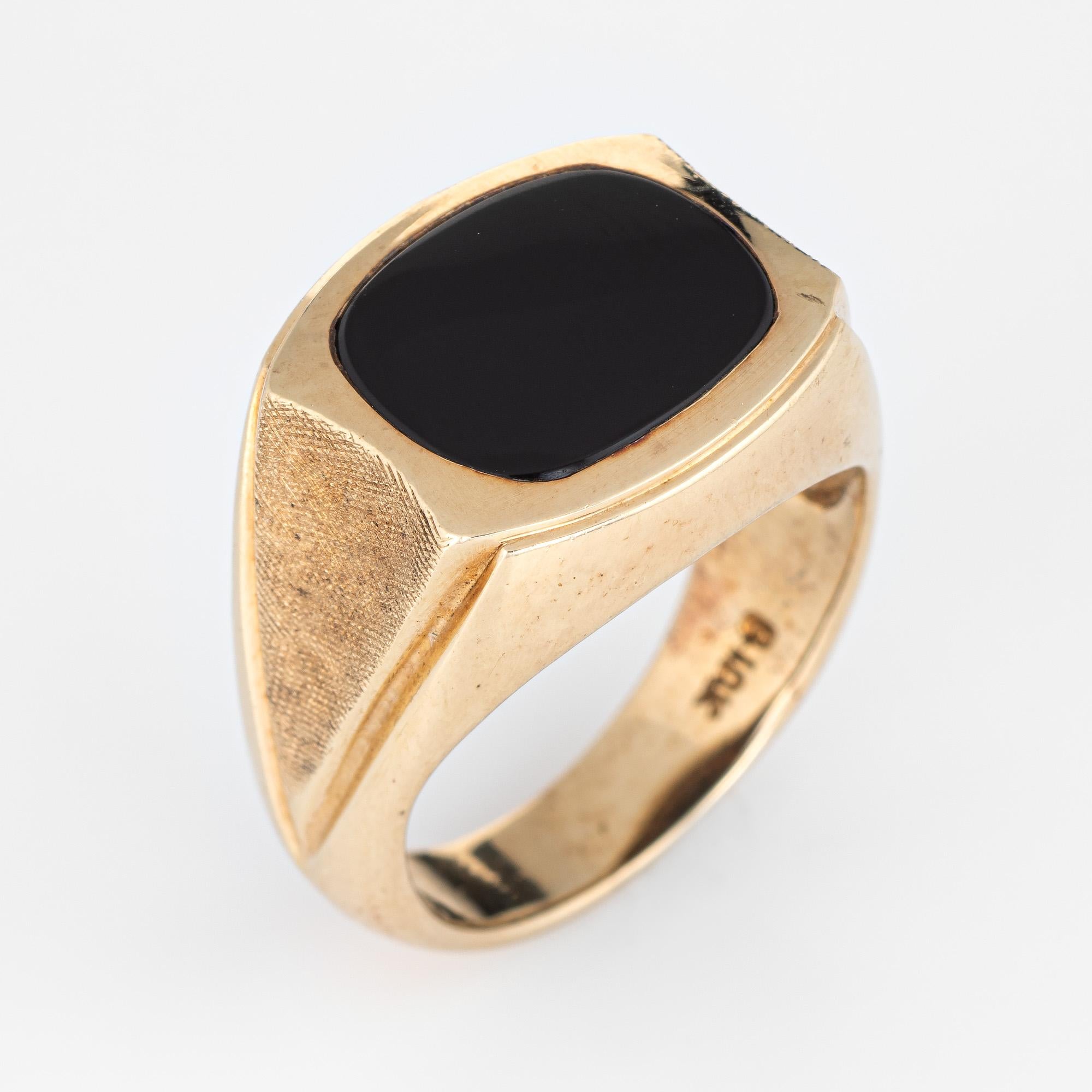 Stylish vintage men's inlaid onyx ring crafted in 10 karat yellow gold (circa 1970s to 1980s). 

Onyx is inlaid into the mount measuring 13.5mm x 11mm. The onyx is in excellent condition and free of cracks or chips. 

The black onyx is inlaid flush