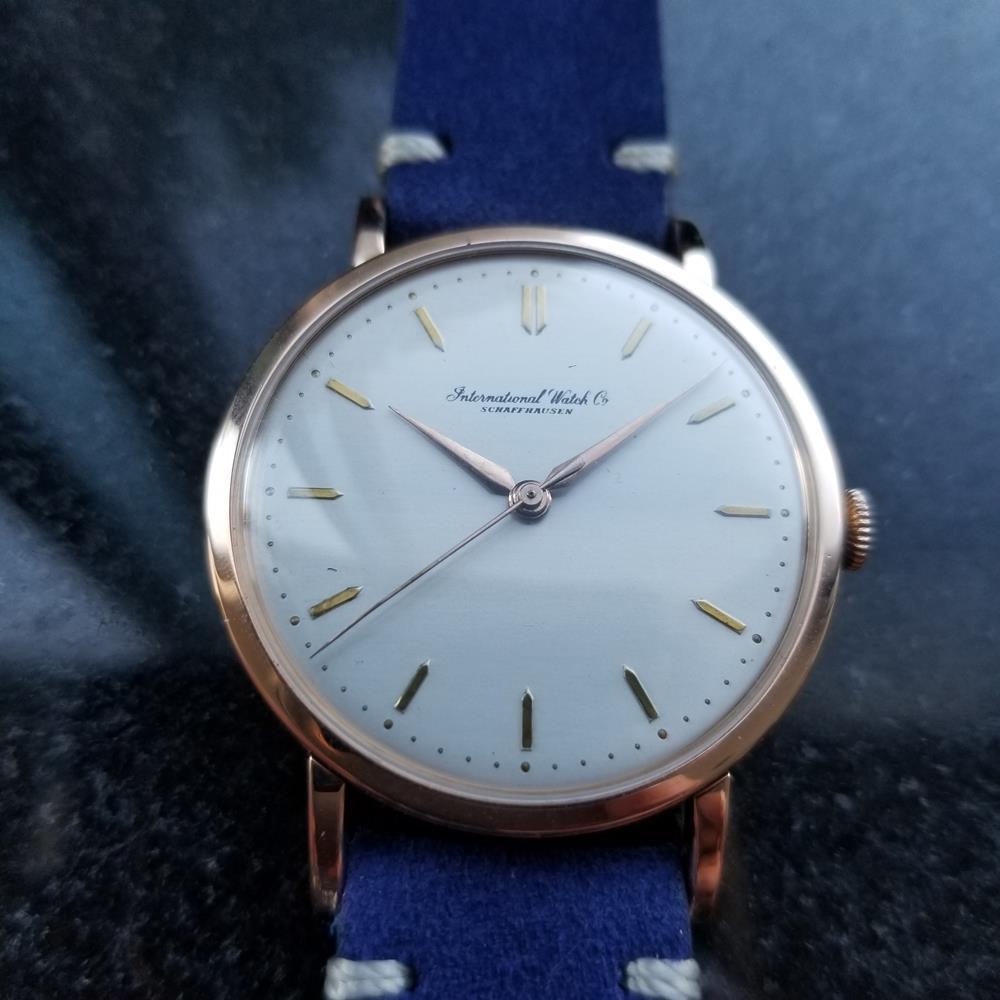 Timeless classic, men's IWC Schaffhausen 18k solid rose gold manual hand-wind dress watch, c.1950s. Verified authentic by a master watchmaker. Gorgeous IWC signed silver dial, applied golden indice hour markers, gilt minute and hour hands, sweeping