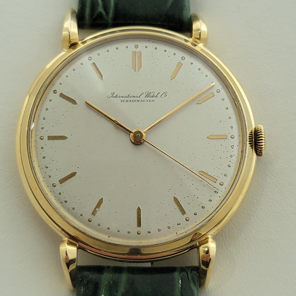  Timeless luxury, Men's jumbo size IWC Schaffhausen solid 18k yellow gold dress watch, c.1960s, in excellent working condition. Verified authentic by a master watchmaker. Gorgeous IWC dial, index hour markers, gilt minute and hour hands, sweeping