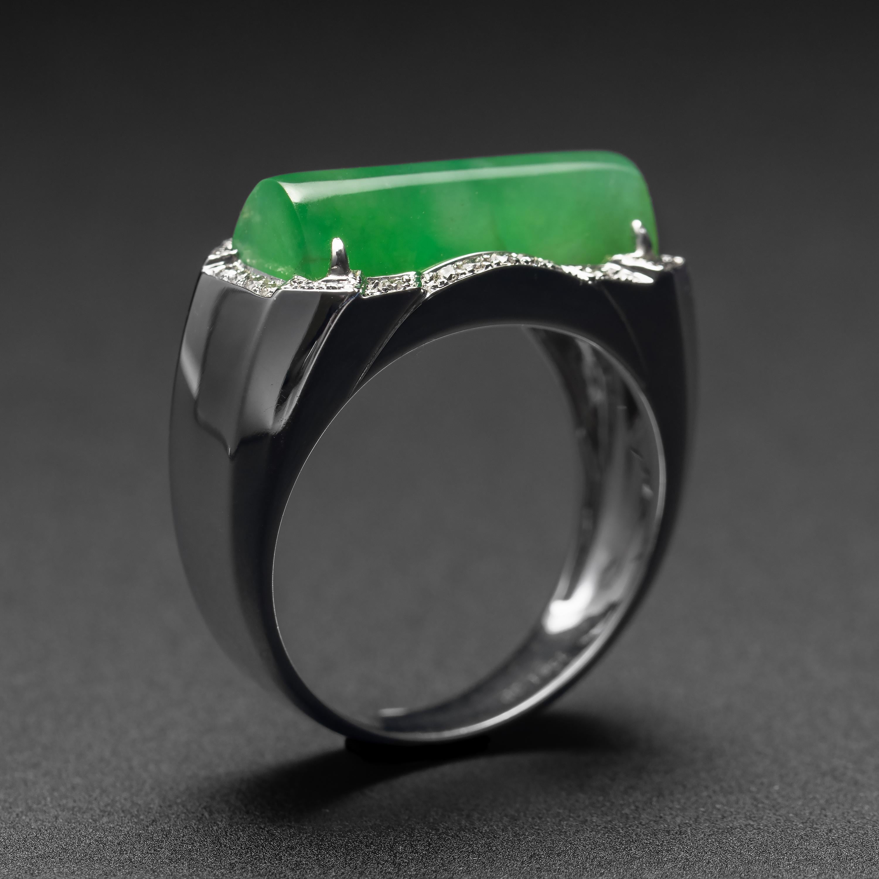 A lush apple-green half-cylinder of natural and untreated Burmese jadeite jade is the bright and impressive focal point of this 18K white gold circa 1990s -though never worn- jade saddle ring. The luminous stone is surrounded by numerous full-cut