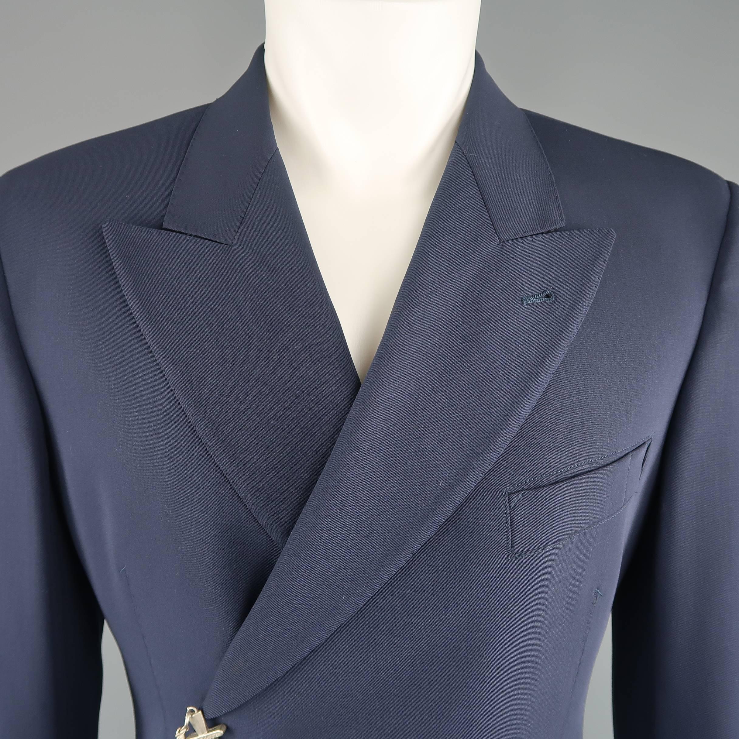 Vintage JEAN PAUL GAULTIER double breasted sport coat comes in a muted navy blue wool twill with a peak lapel, ventless back, and silver tone metal dagger closure. Discolorations throughout. As-is. Made in Italy.
 
Fair Pre-Owned Condition.
Marked: