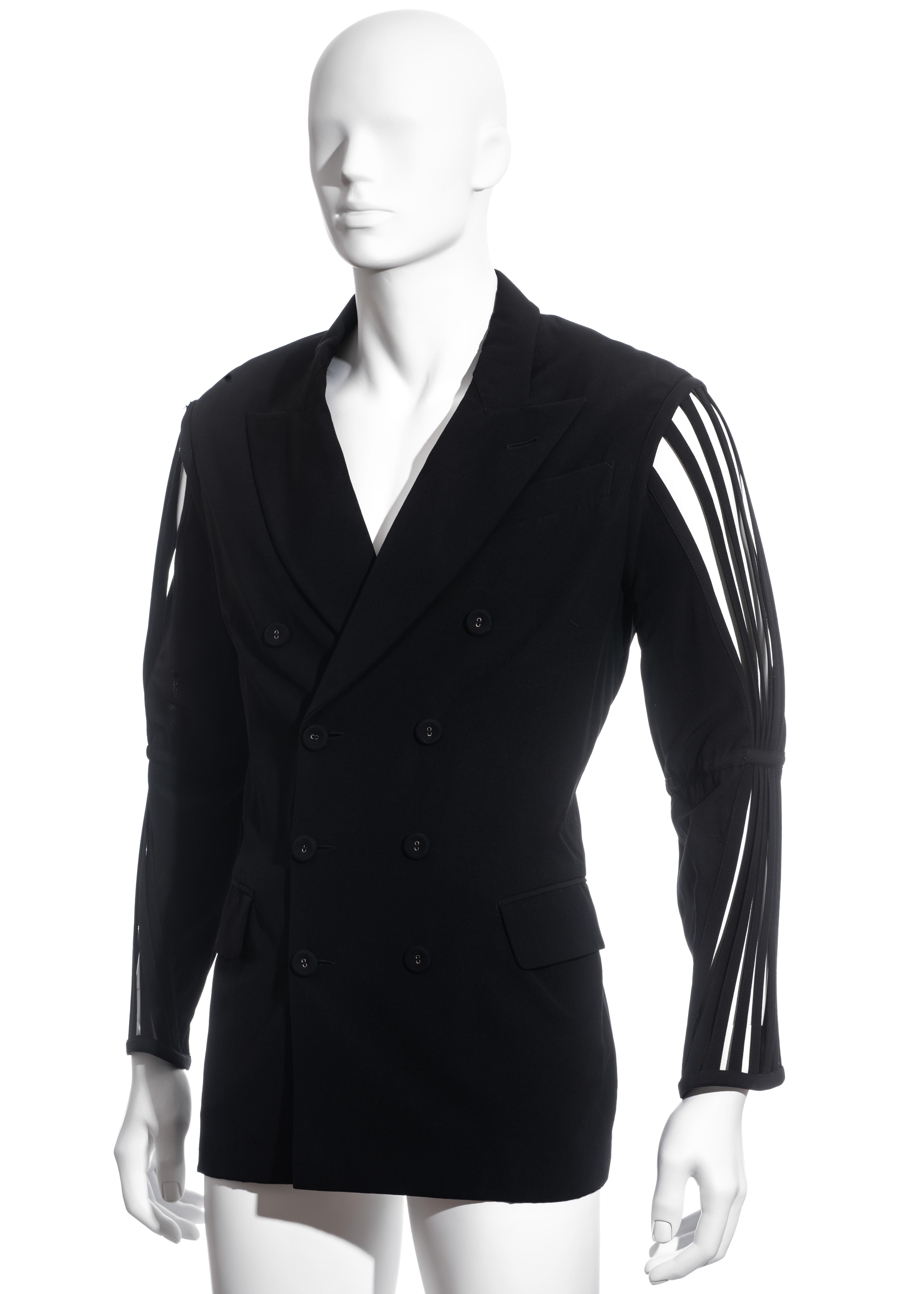 ▪ Men's Jean Paul Gaultier black double-breasted blazer jacket
▪ 100% Wool
▪ Caged sleeves 
▪ Peak lapels
▪ Provenance: Pete Burns (1959–2016)
▪ Size 48
▪ Spring-Summer 1989
