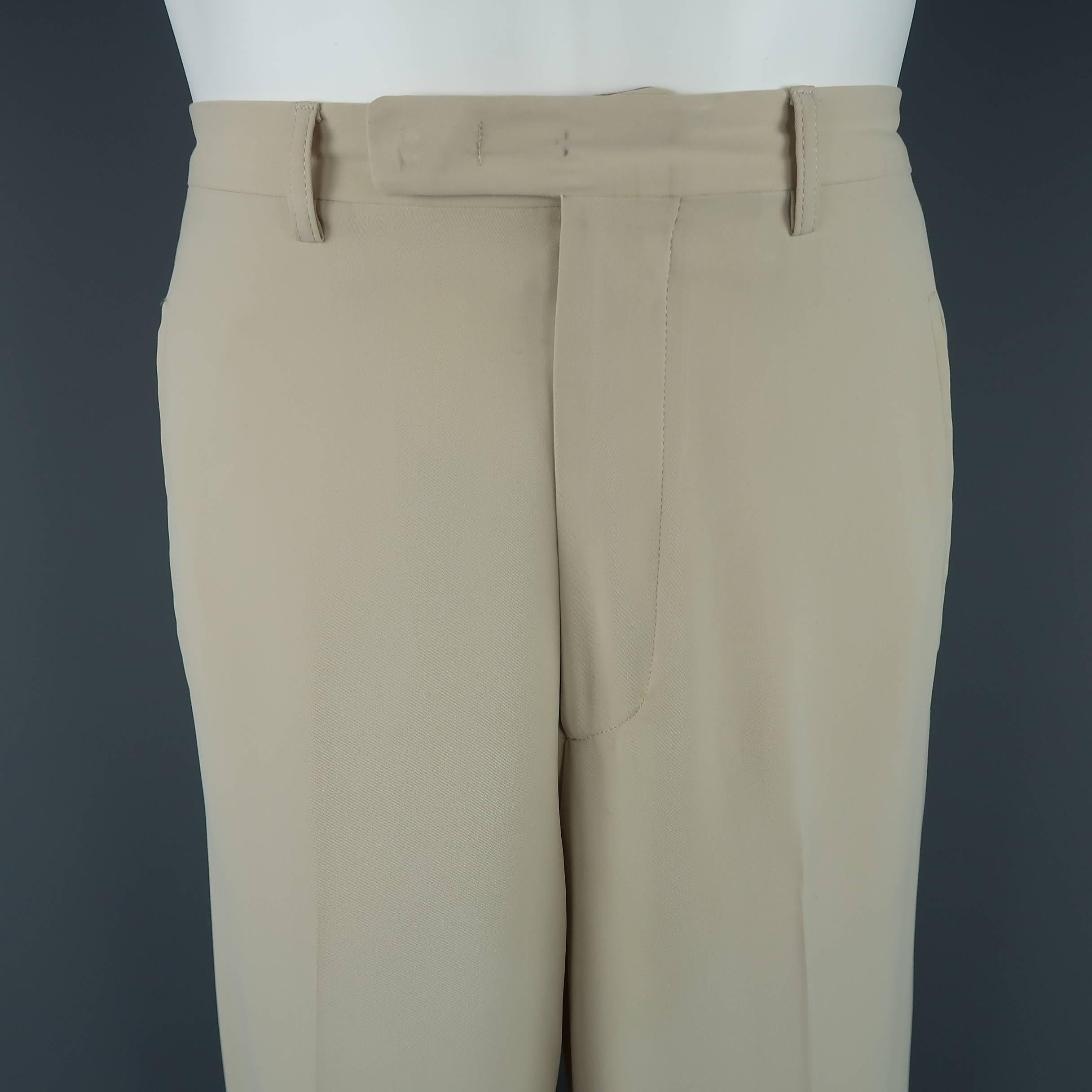 JEAN PAUL GAULTIER CLASSIQUE dress pants come in a light weight light cream khaki twill with a hidden closure waistband, wide straight leg, and signature back tab.
Discolorations. As-is. Made in Italy.
 
Fair Pre-Owned Condition.
Marked: 30
