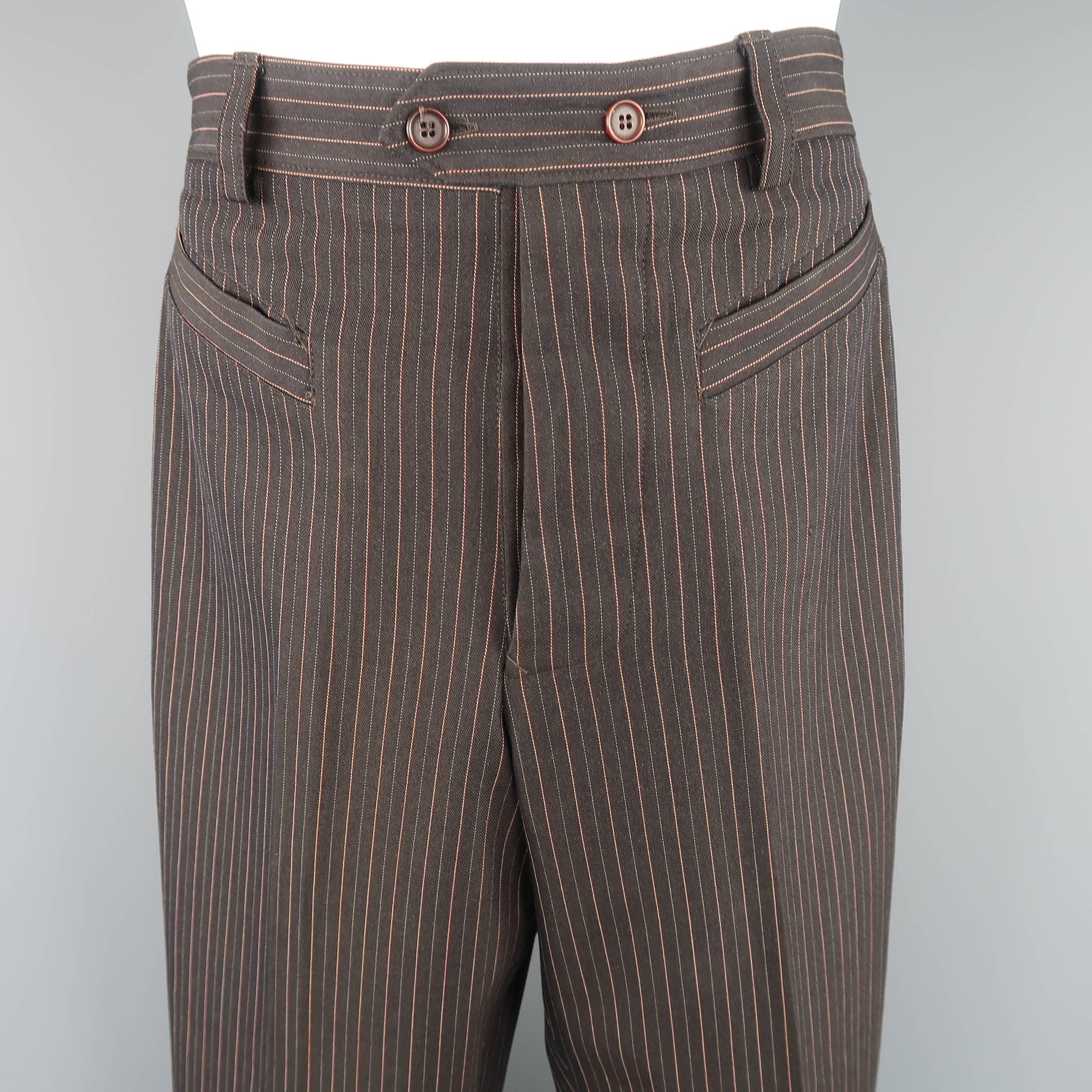 JEAN PAUL GAULTIER HOMME trousers come in brown twill with dual color pinstripe pattern a high rise, slanted pockets, and signature back tab. Made in Italy.
 
Excellent Pre-Owned Condition.
Marked: IT 48
 
Measurements:
 
Waist: 31 in. (+2