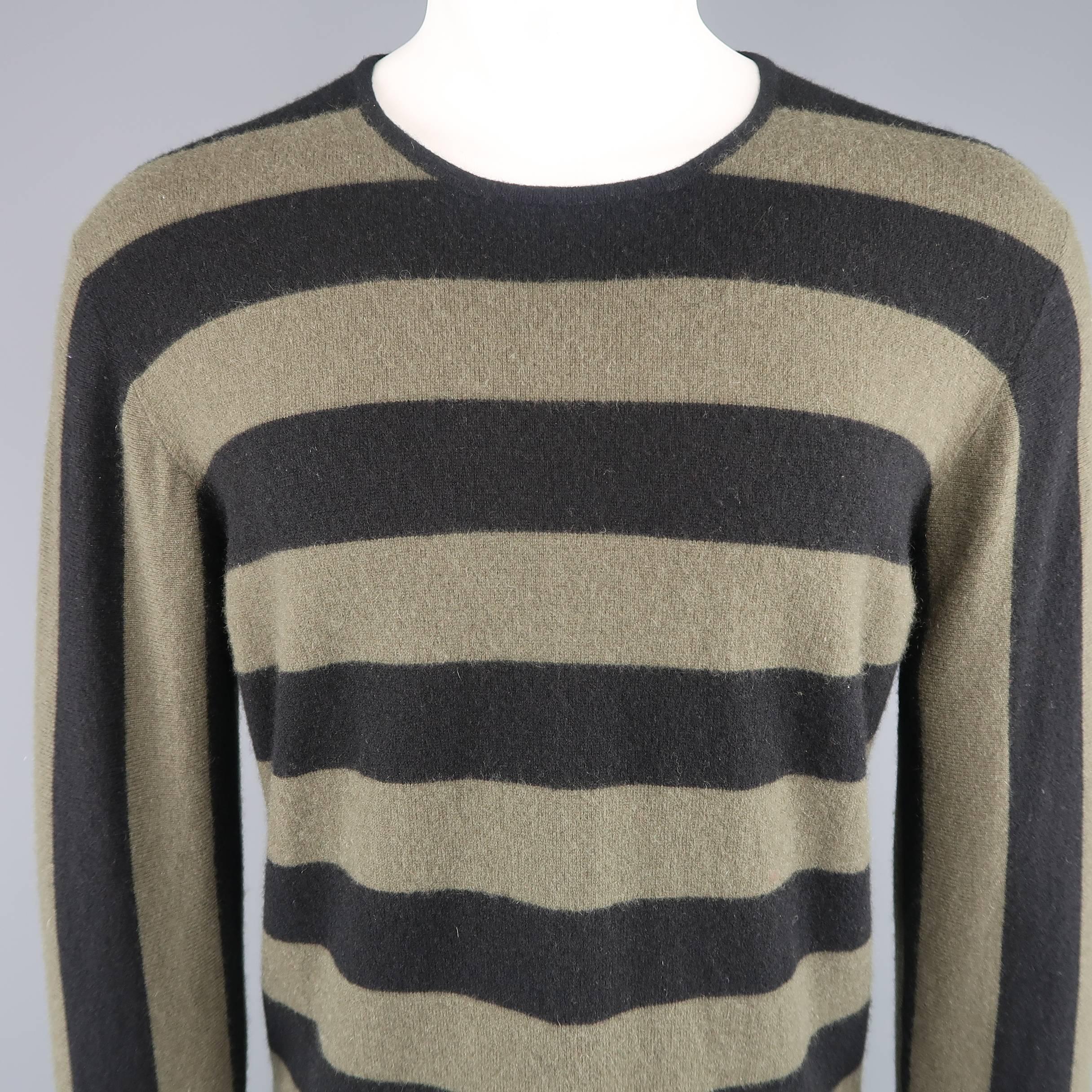 JIL SANDER pullover sweater comes in olive green soft cashmere knit with all over diagonal black stripe patter that extends in vertical striped sleeves. Made in Italy.
 
Good Pre-Owned Condition.
Marked: (no size)
 
Measurements:
 
Shoulder: 18