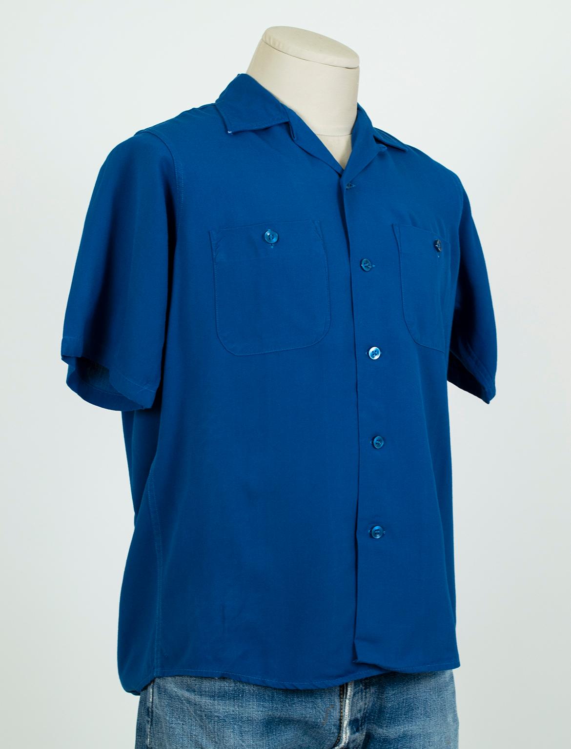 When American suburbanites embraced bowling in the 1950s, there was no more coveted label in bowling shirts than King Louie. Bright and vibrant, this “striking” blue example has been left without branding…and begs for a breast patch or league