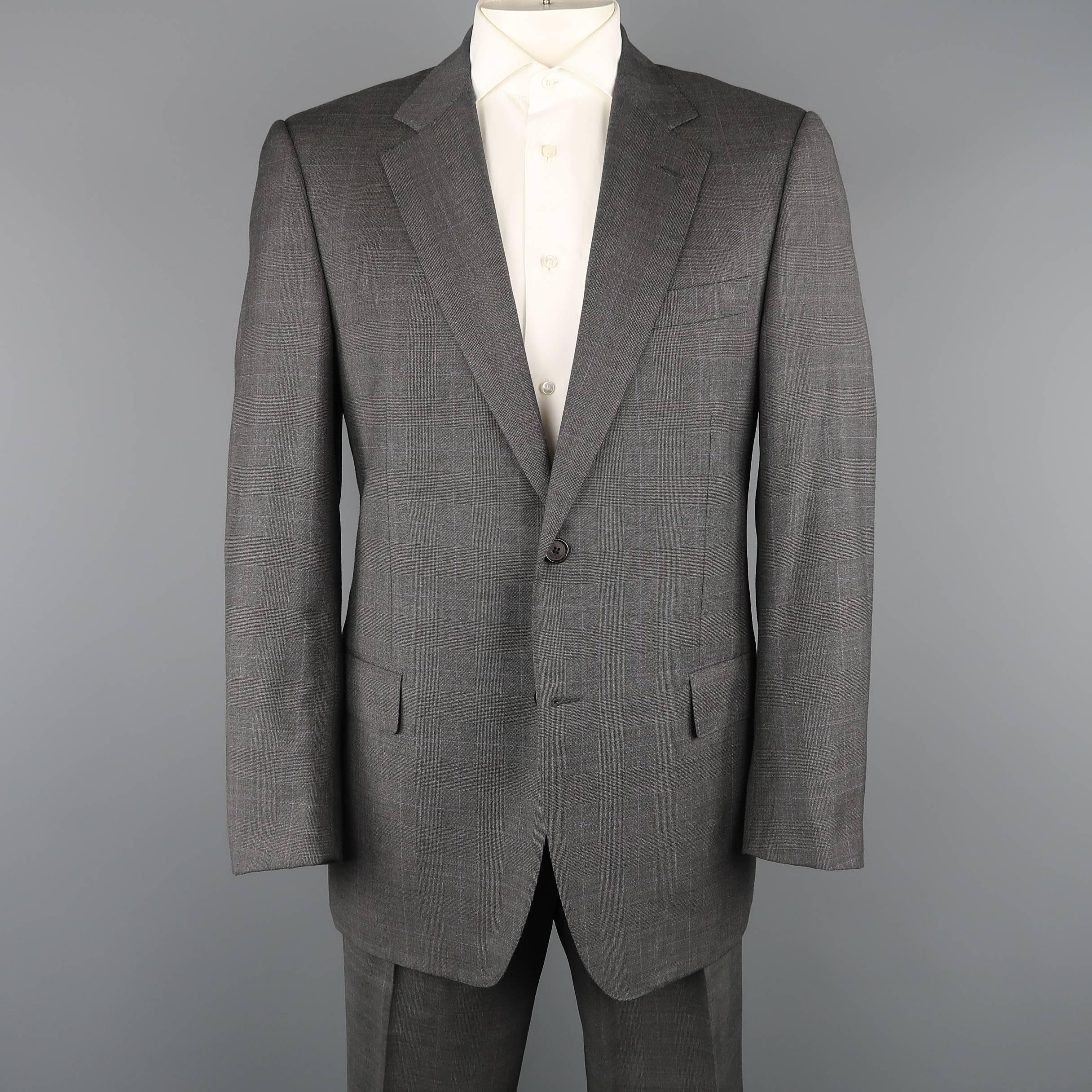 LANVIN suit comes in dark gray and lavender Glenplaid wool with and includes a single breasted, two button notch lapel, two button sport coat and matching single pleated trousers. Made in Italy.
 
Good Pre-Owned Condition.
Marked: IT 52
