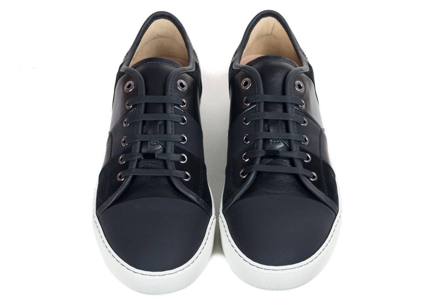 Brand New In Original Box
Retails Online and In-stores for $565
Size UK 10/ US 11 Fits True to Size

The Lanvin Vertical Striped Sneaker is truly on of a kind. These sleek leather inserts paired with the smooth cap toe style gives your shoe an