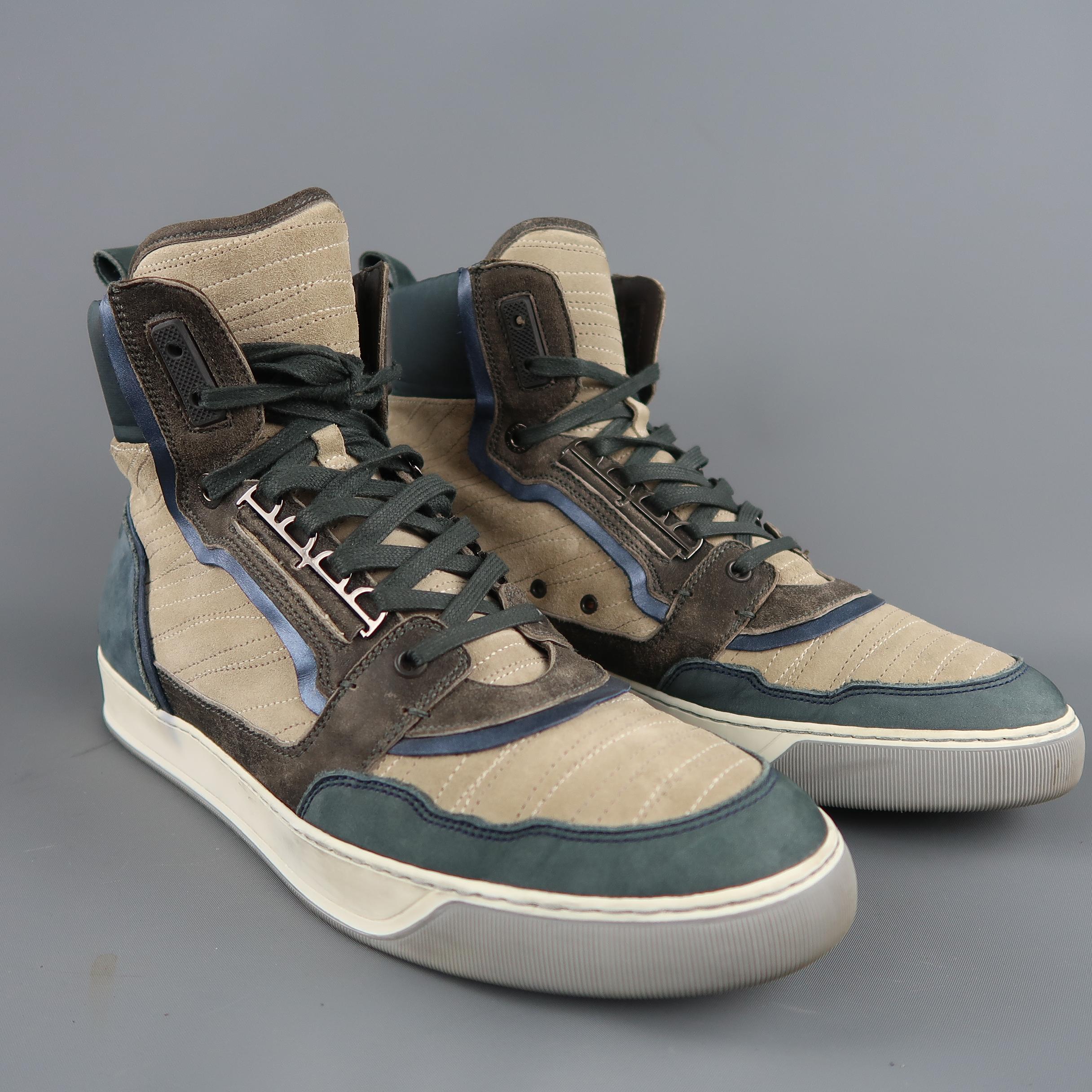 LANVIN high top sneakers come in beige suede with taupe suede accents, metallic navy blue leather piping, blue suede panels, satin ankle, and cream rubber sole. Made in Italy.
 
Good Pre-Owned Condition.
Marked: UK 11
 
Measurements:
 
Length: 12.5